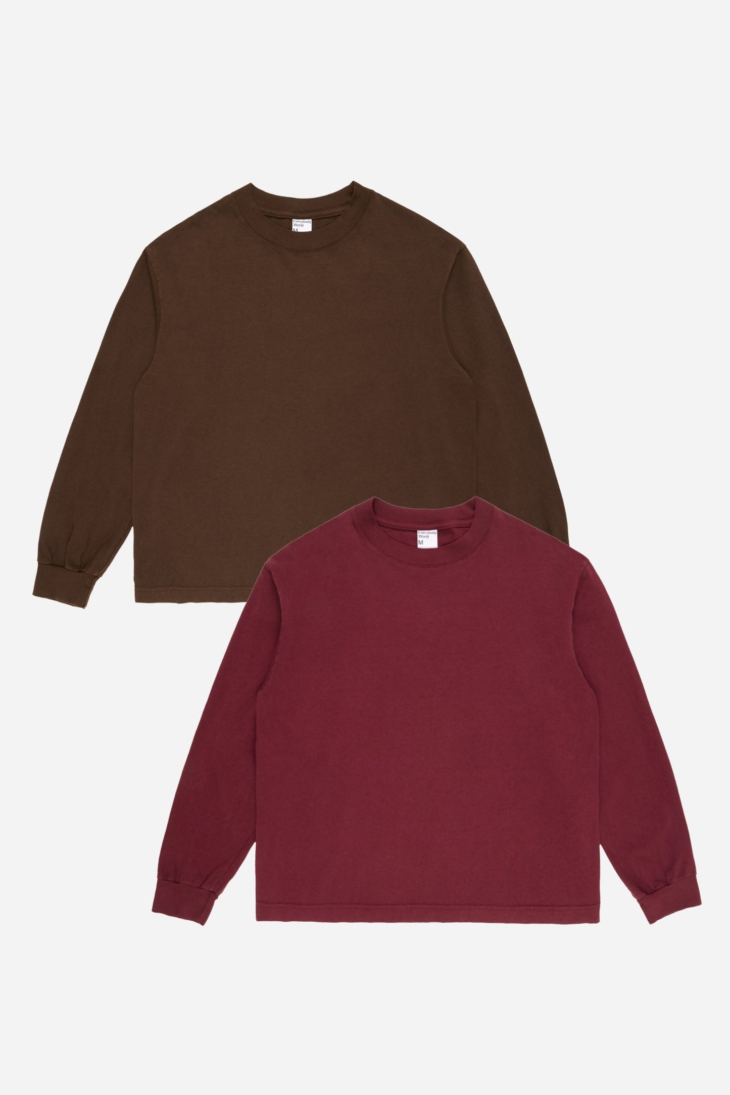 Flat lay of Burgundy and Soil long sleeve tees