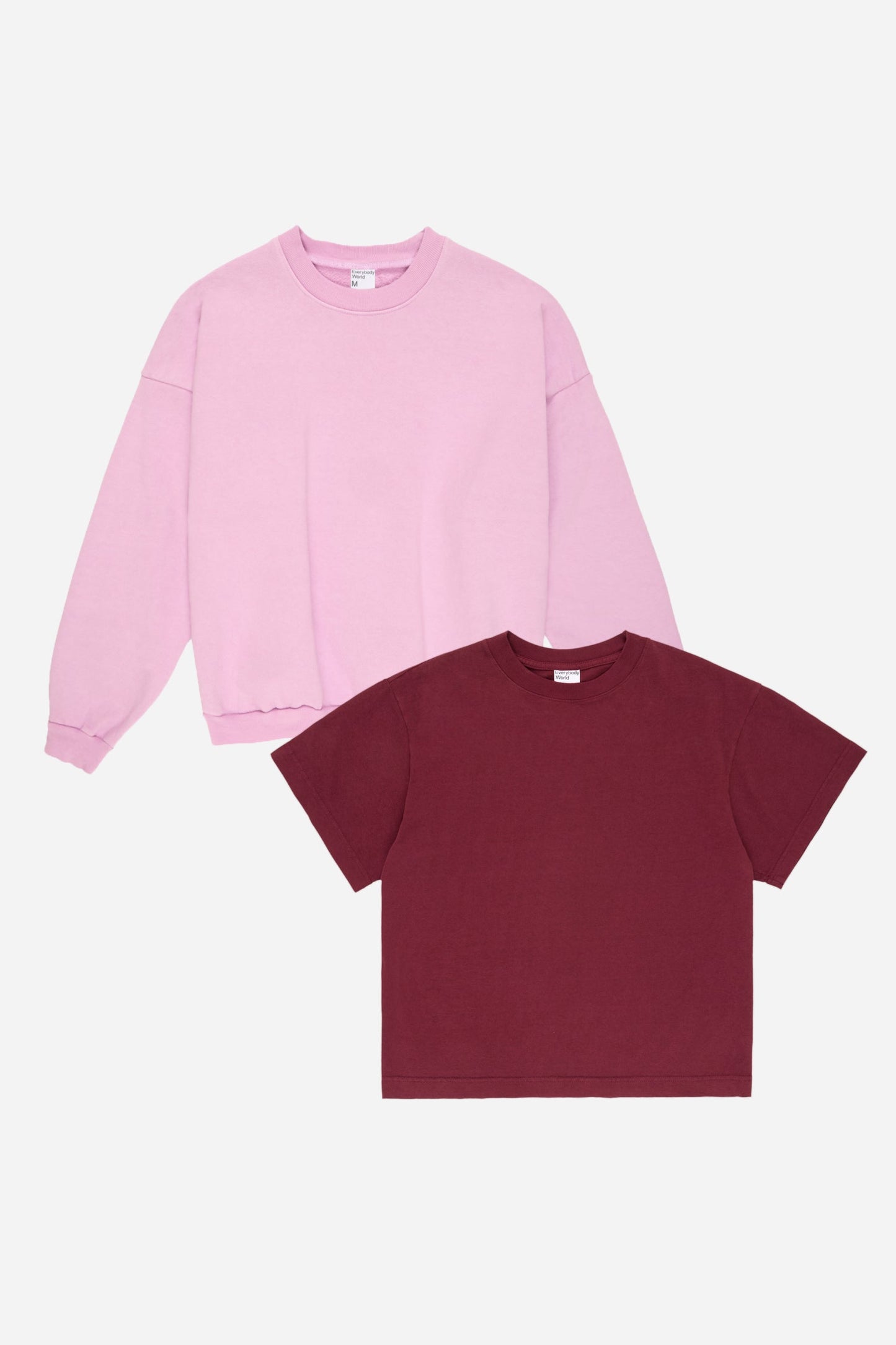 Lavender sweatshirt and Burgundy t-shirt on a white background