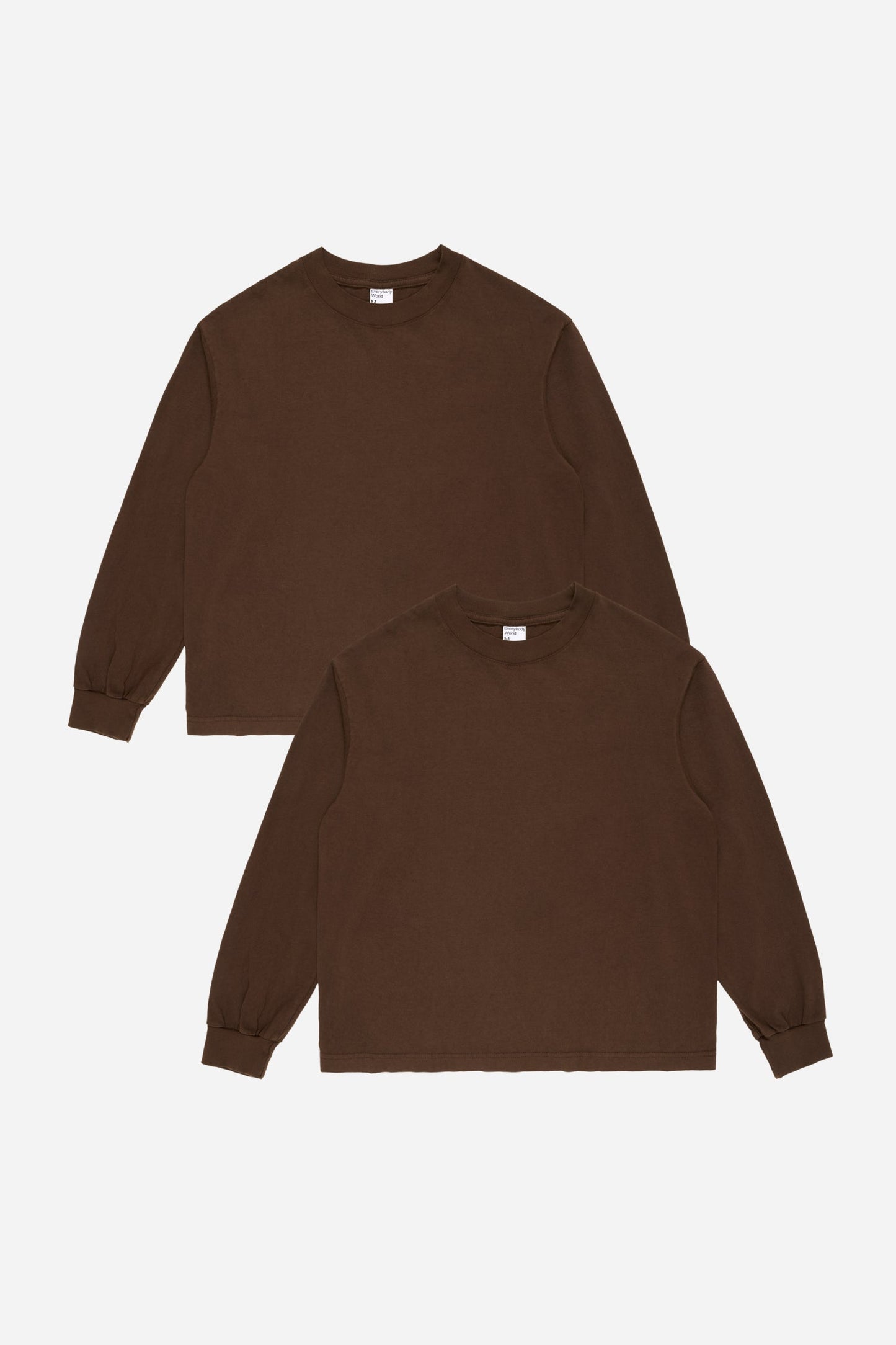 Two brown long-sleeve shirts on a white background