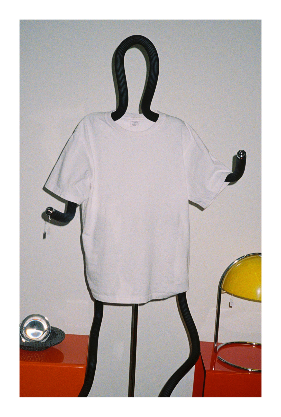 White Trash Tee on a black mannequin against a plain background
