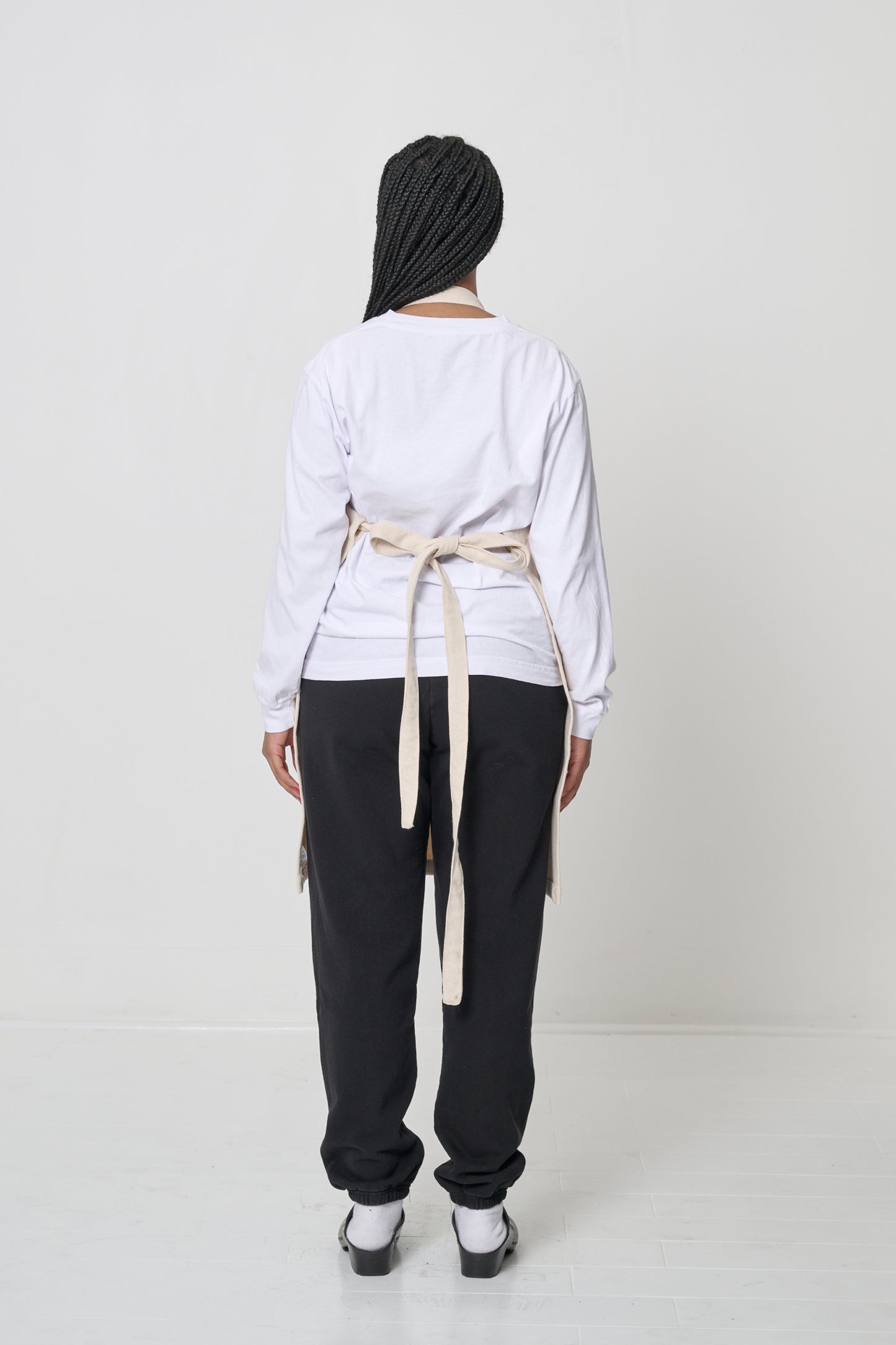 Rear view showing the neck loop and waist straps tied.