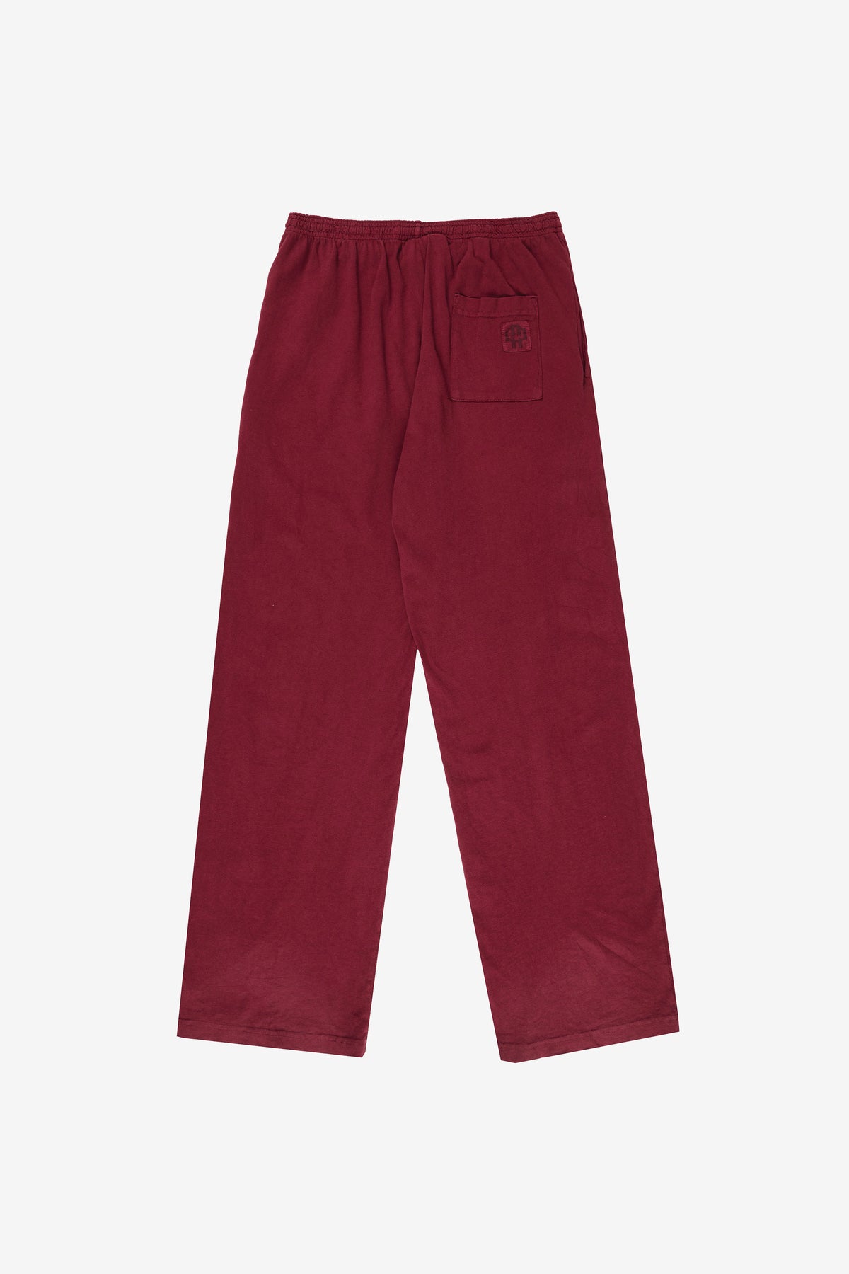 Apartment Pants in Garnet – flat lay back view, no model