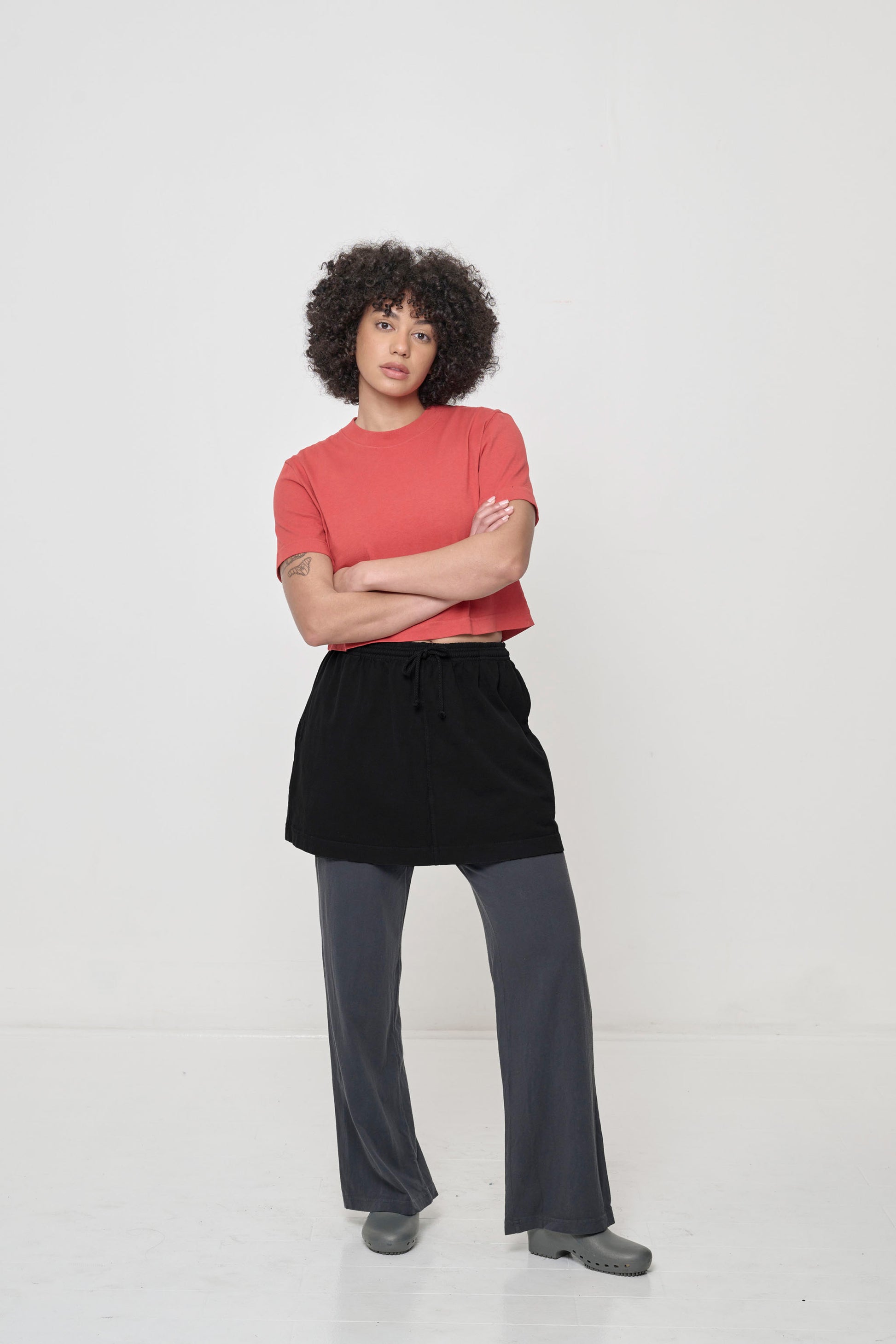 Styled with black mini skirt and Apartment Pants.