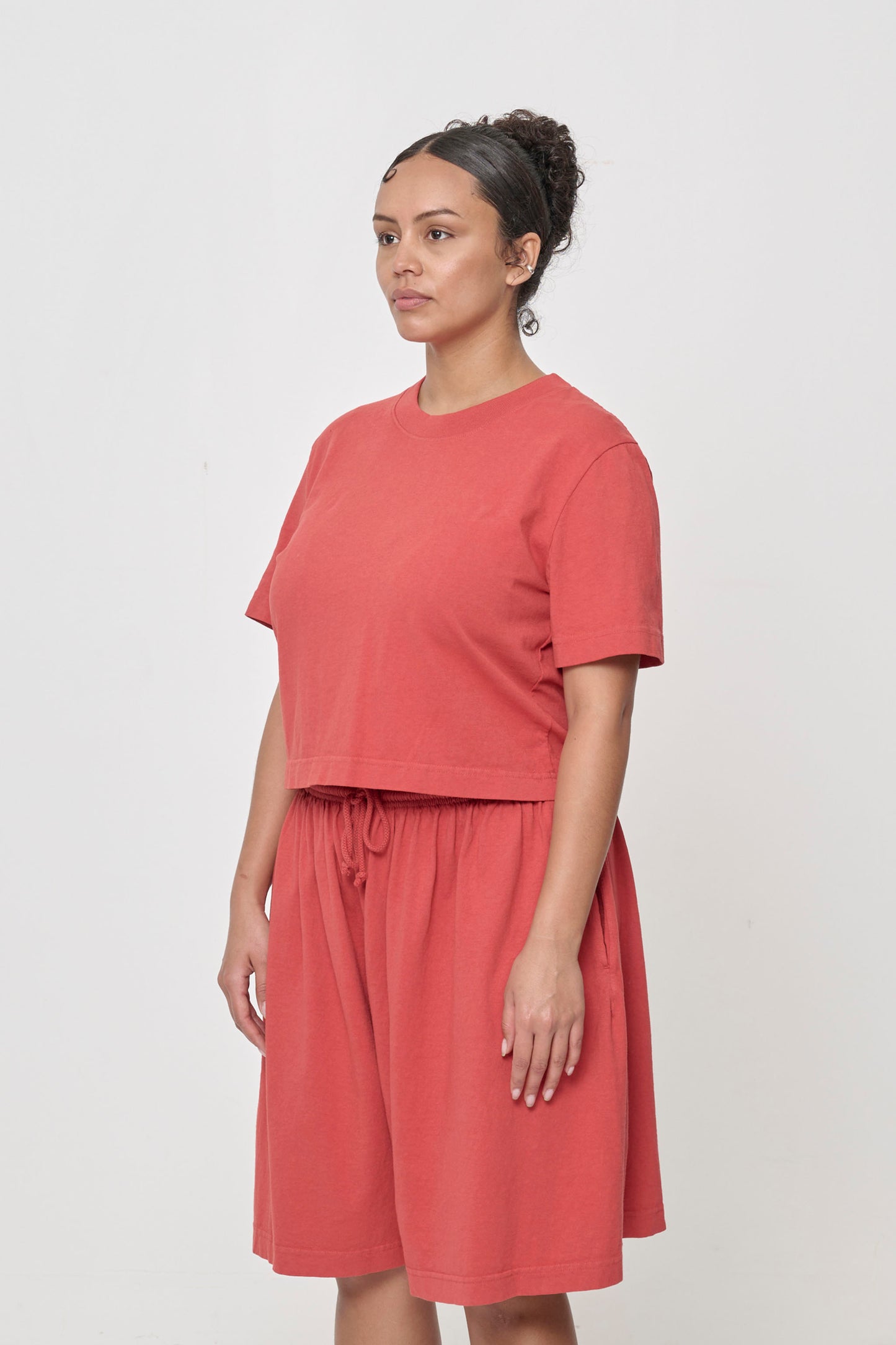 3/4 front view showing classic relaxed yet slim short sleeves and side seams.