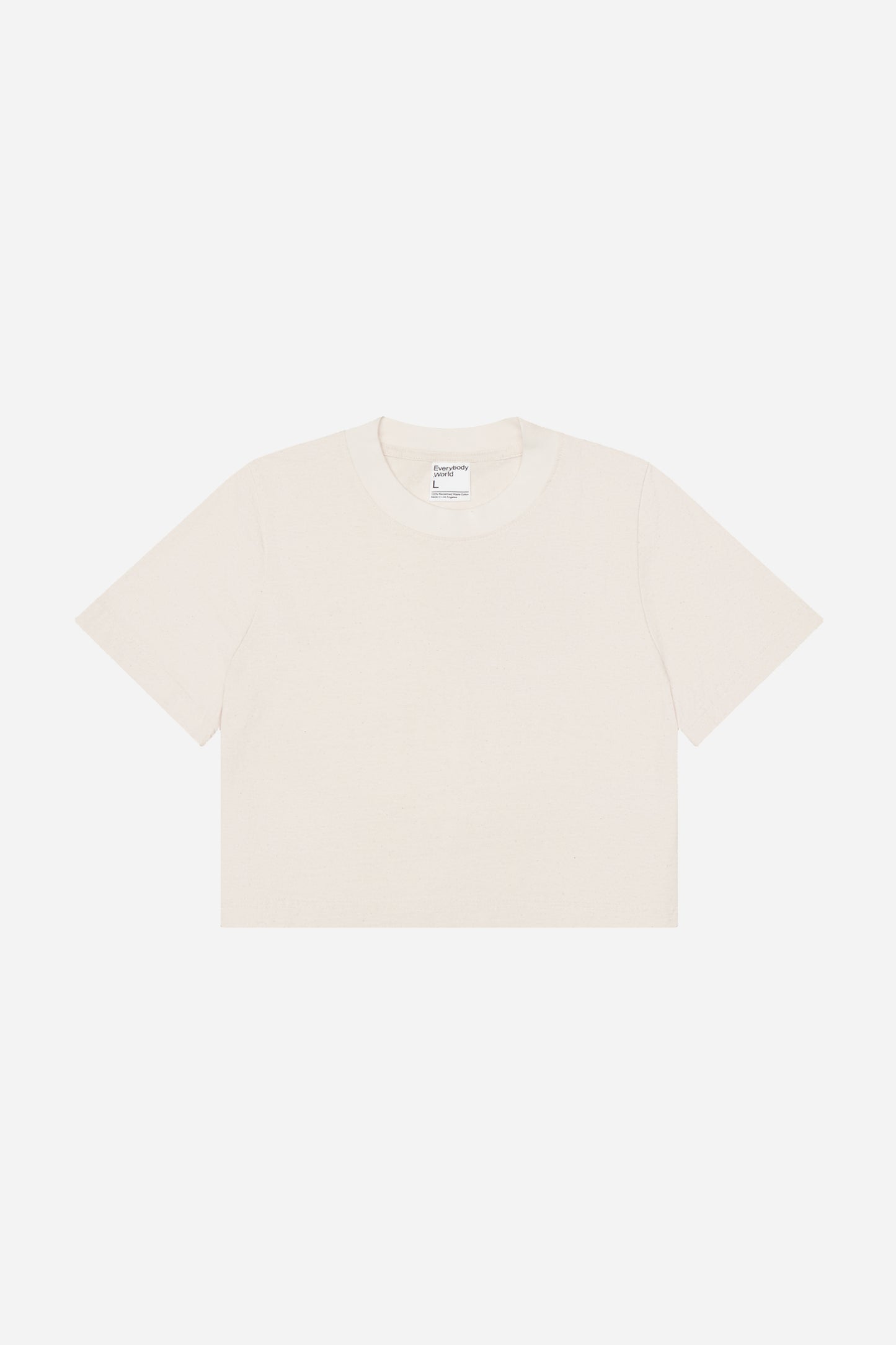 Flat lay showing cream colored t-shirt's silhouette