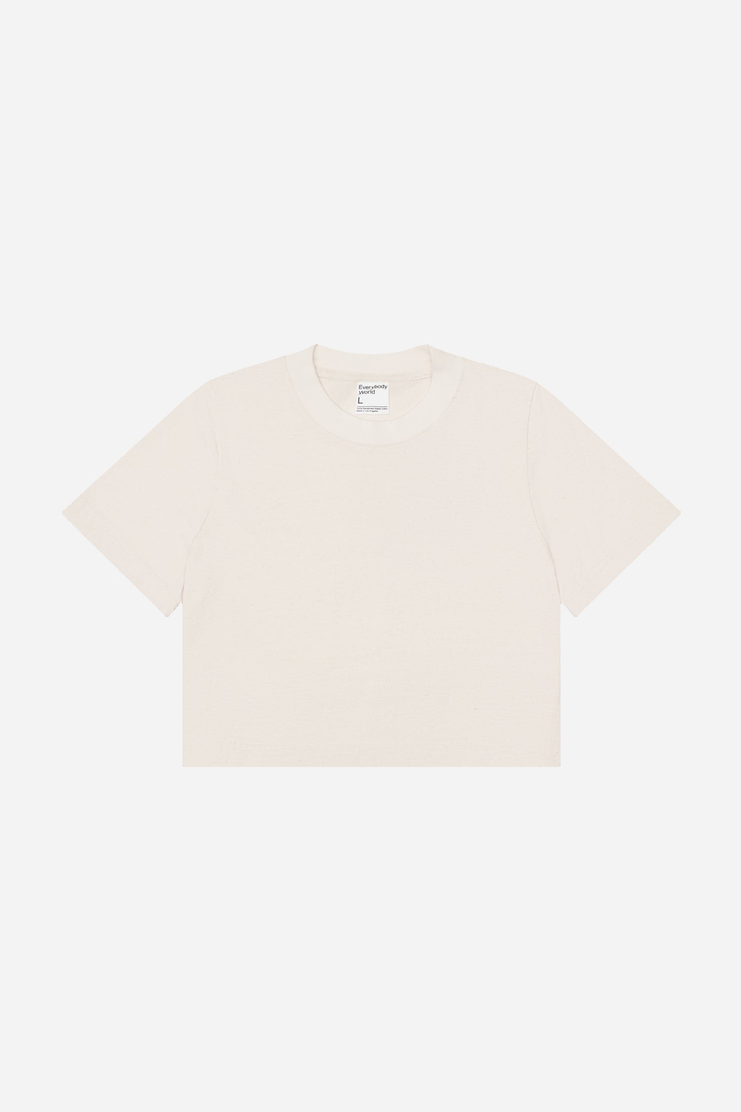 Flat lay showing cream colored t-shirt's silhouette