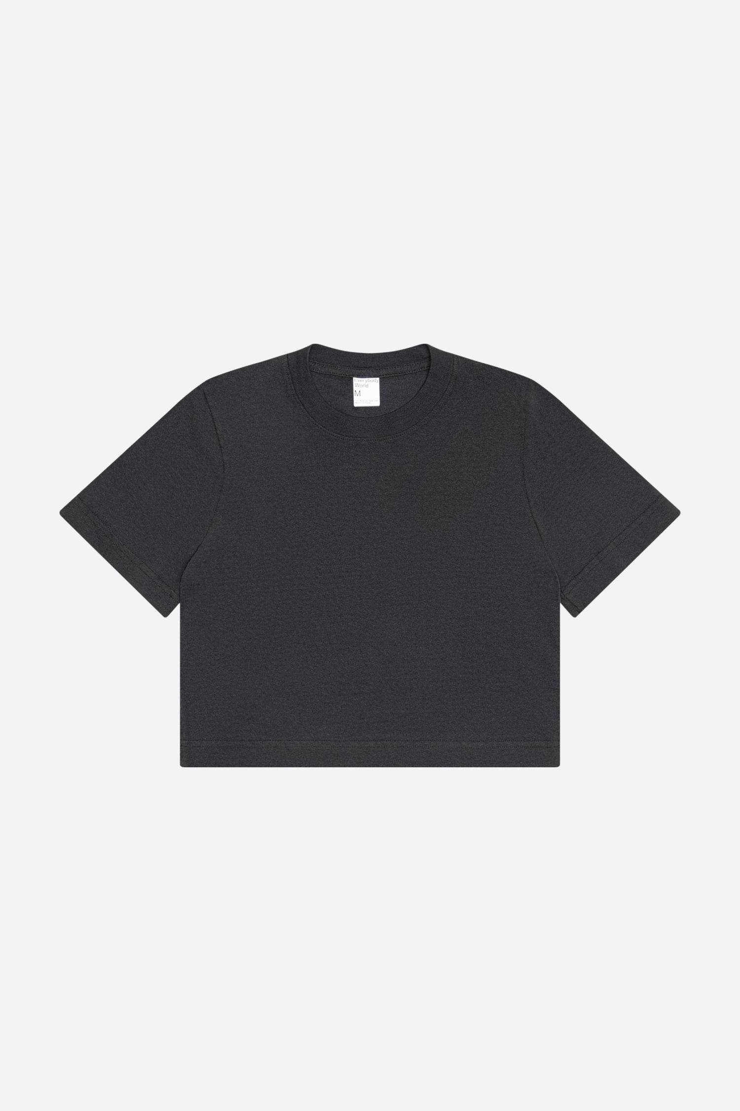 Flat lay showing dark gray t-shirt's silhouette and construction details