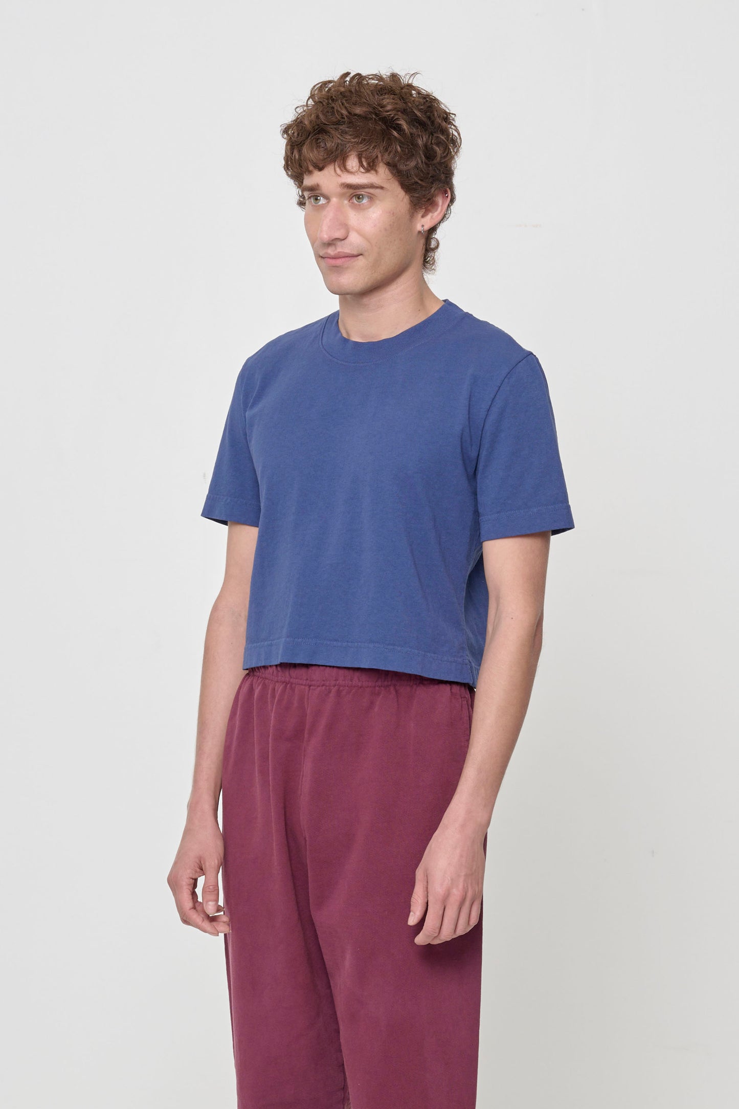 3/4 front view showing relaxed yet slim short sleeves and side seams.