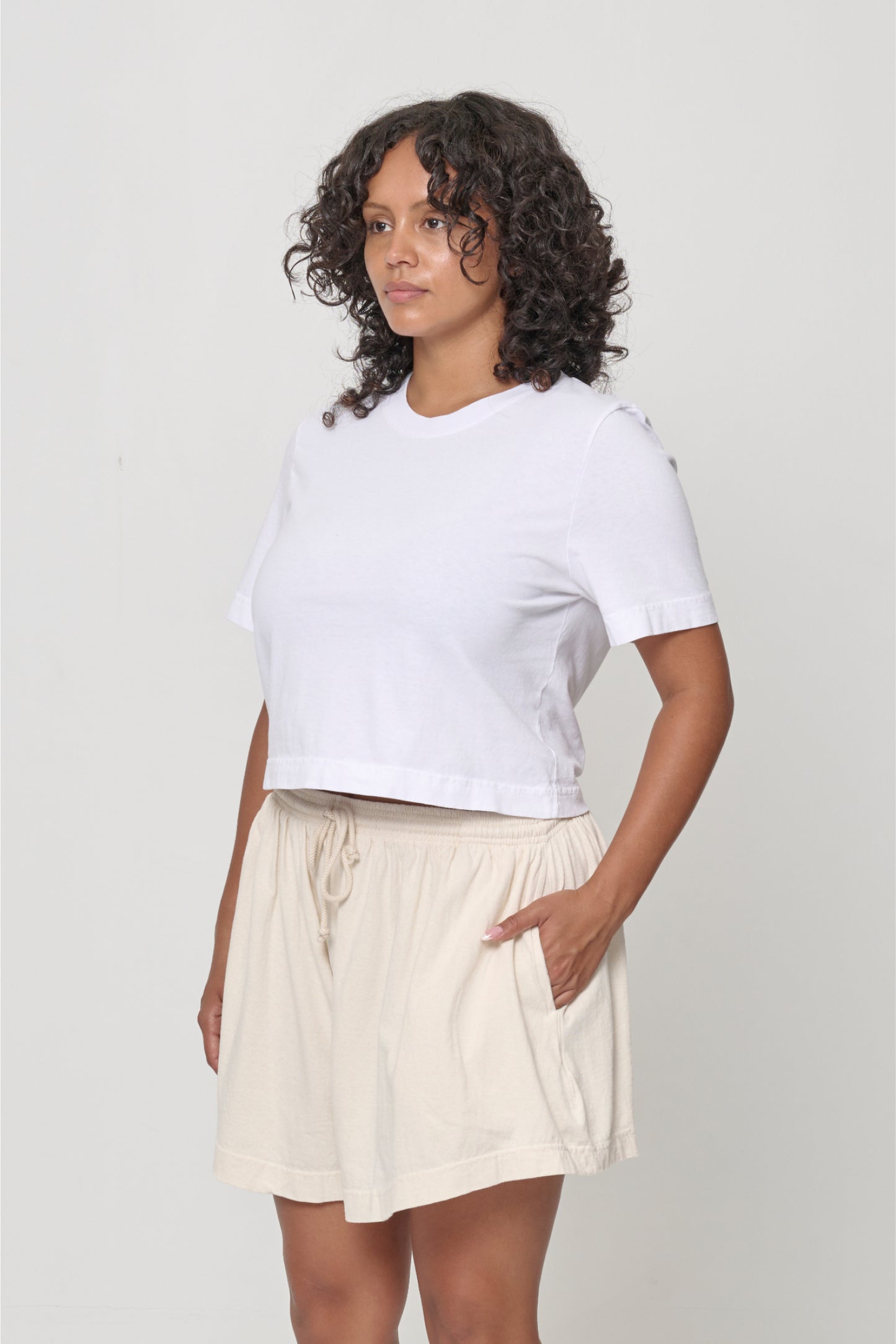3/4 front view showing classic relaxed yet slim short sleeves and side seams.
