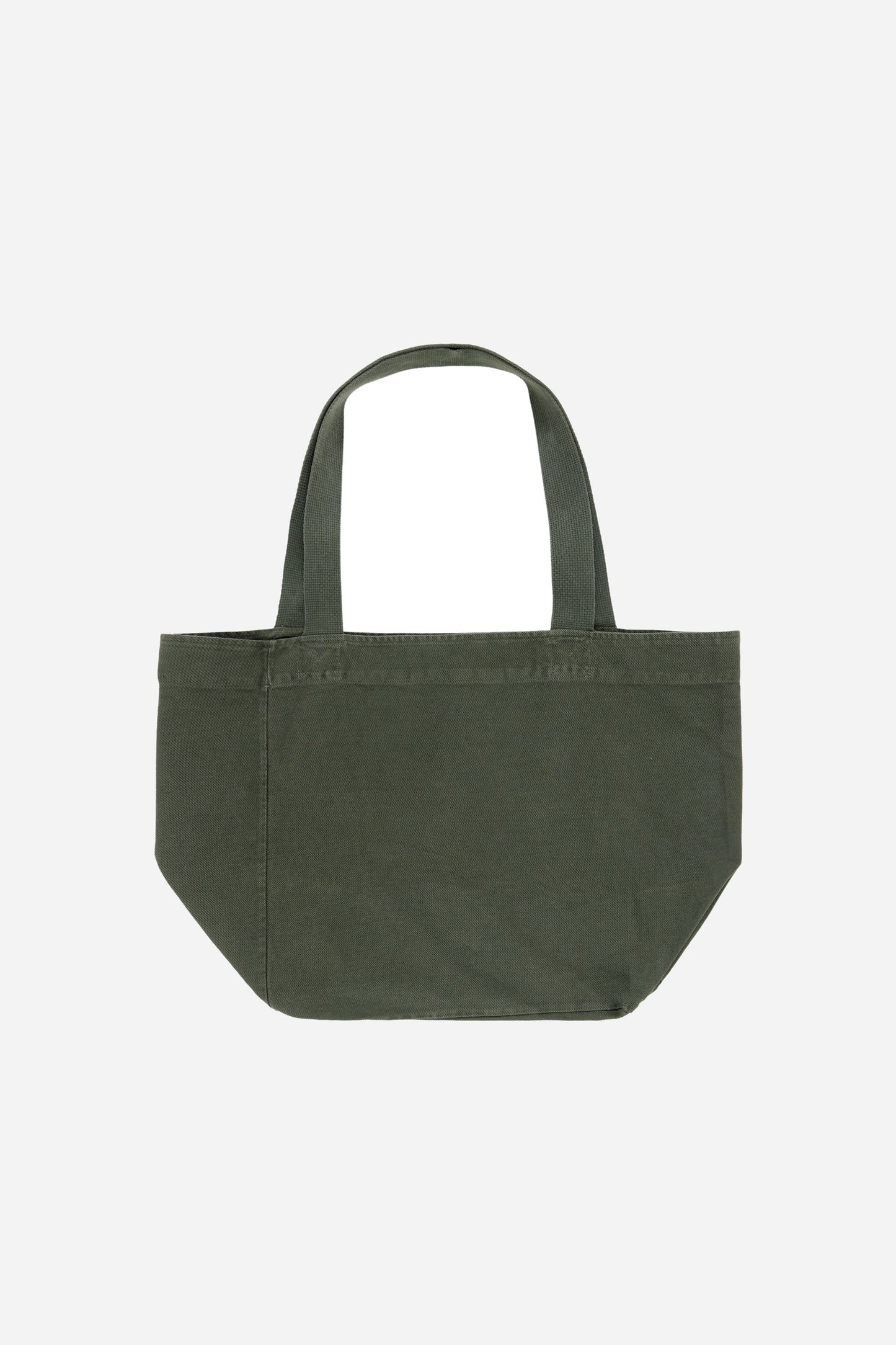 Flat lay of Big Tote in Pine greyish dark green, showing depth, stitching, and web straps.