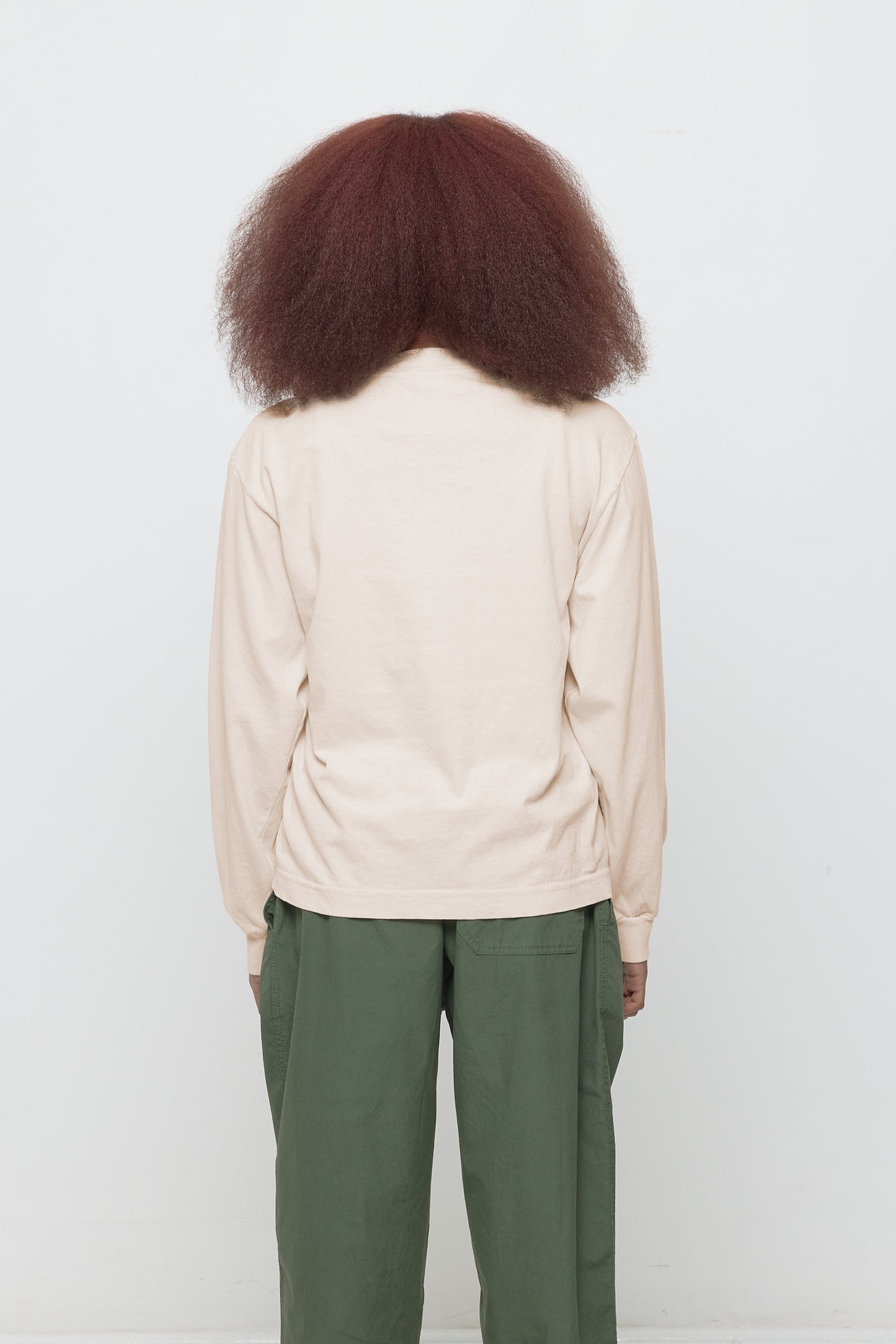 Back view showing fabric drape and relaxed fit throughout.