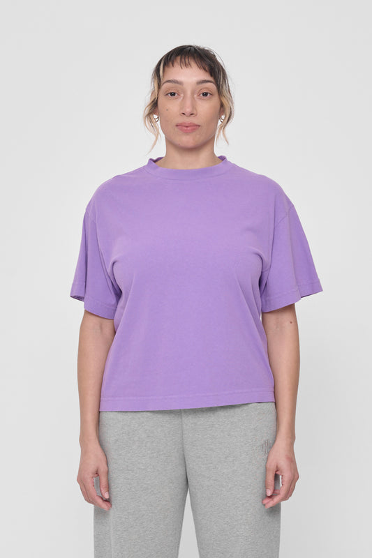 A 5'4" woman in a size S Carpe Diem Boxier Trash Tee. Hem at upper-middle hip.