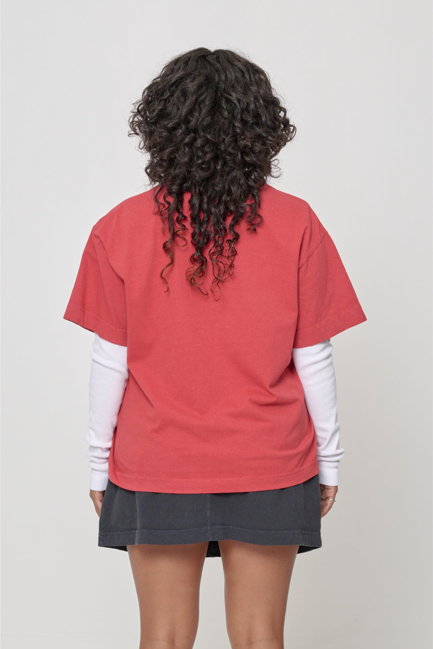 Back view showing fabric drape and relaxed fit throughout.