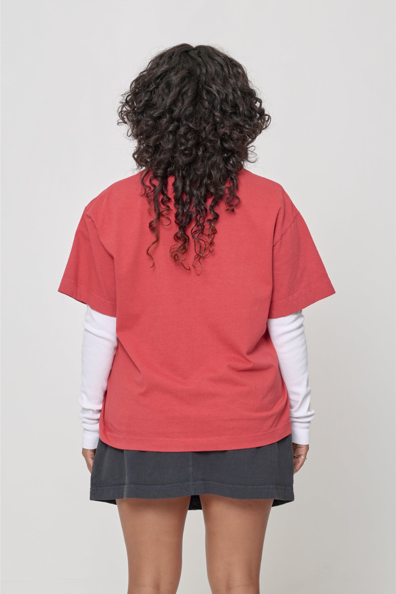 Back view showing fabric drape and relaxed fit throughout.