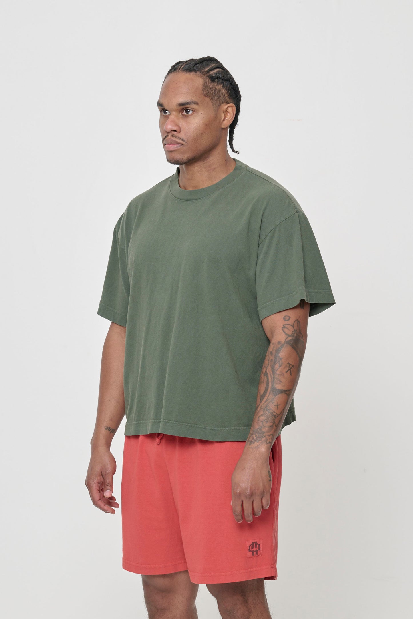 3/4 front view showing no side seams and slightly wider than traditional short sleeves.
