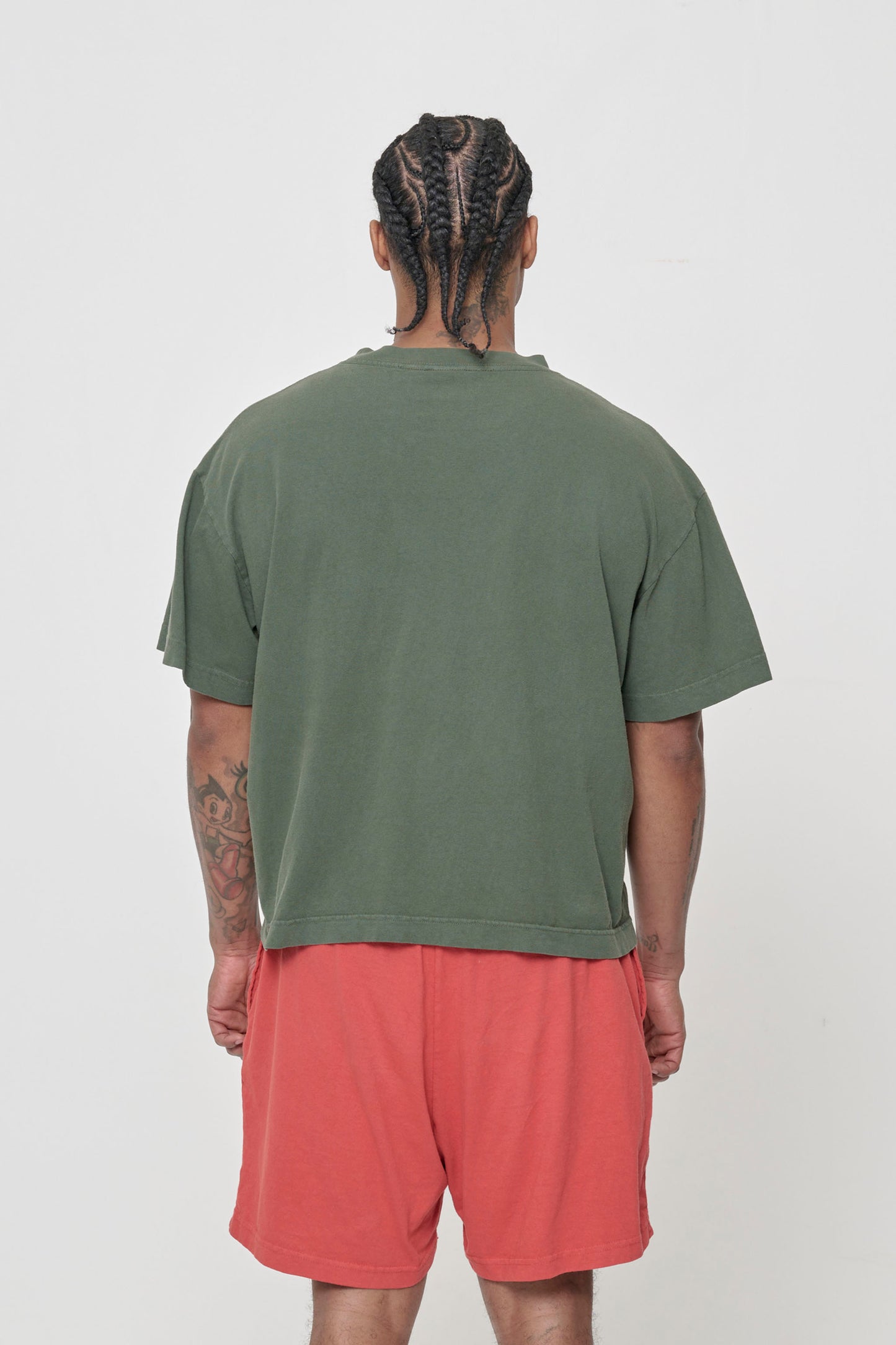Back view showing fabric drape and relaxed fit throughout.