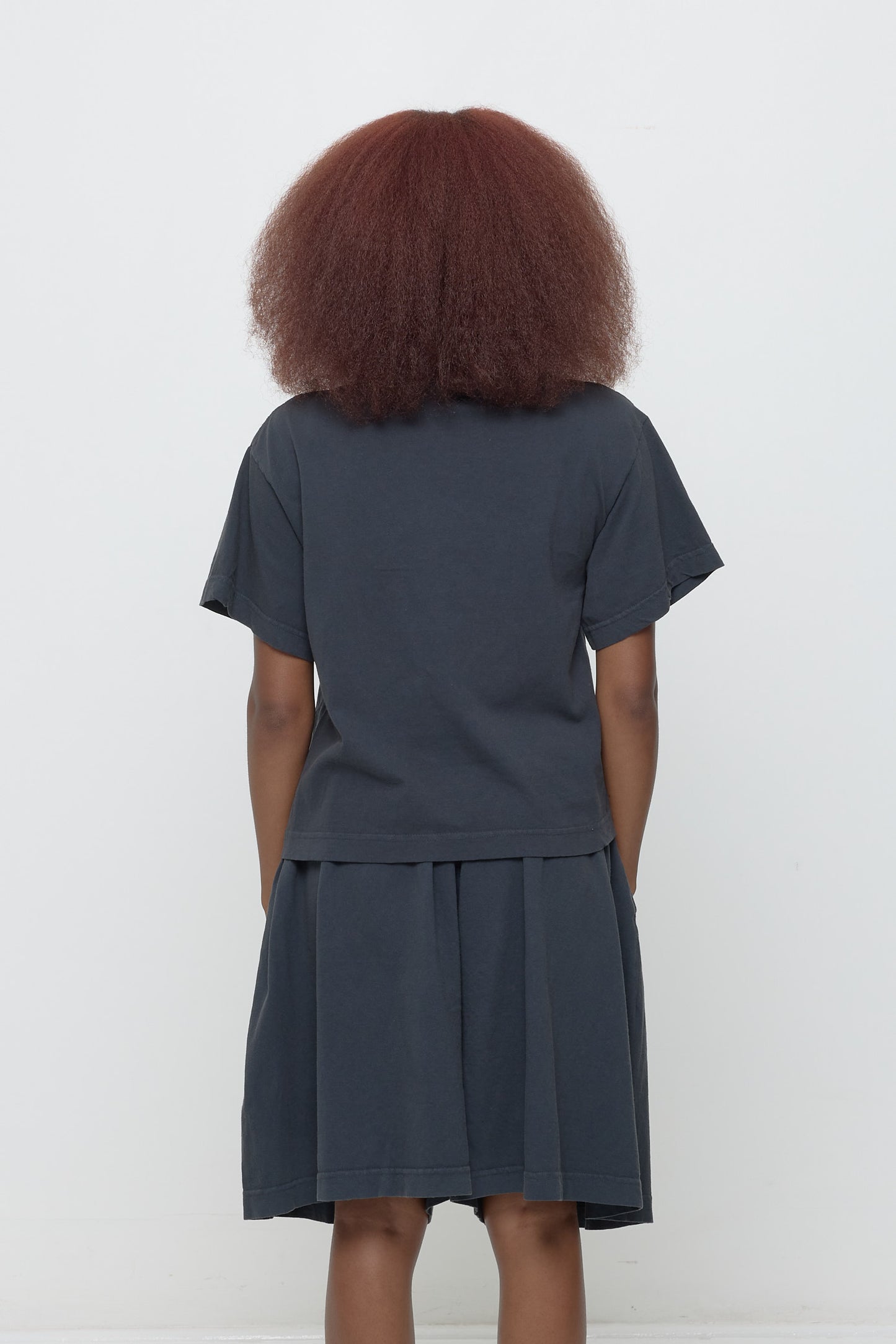 Back view showing fabric drape and relaxed fit throughout.