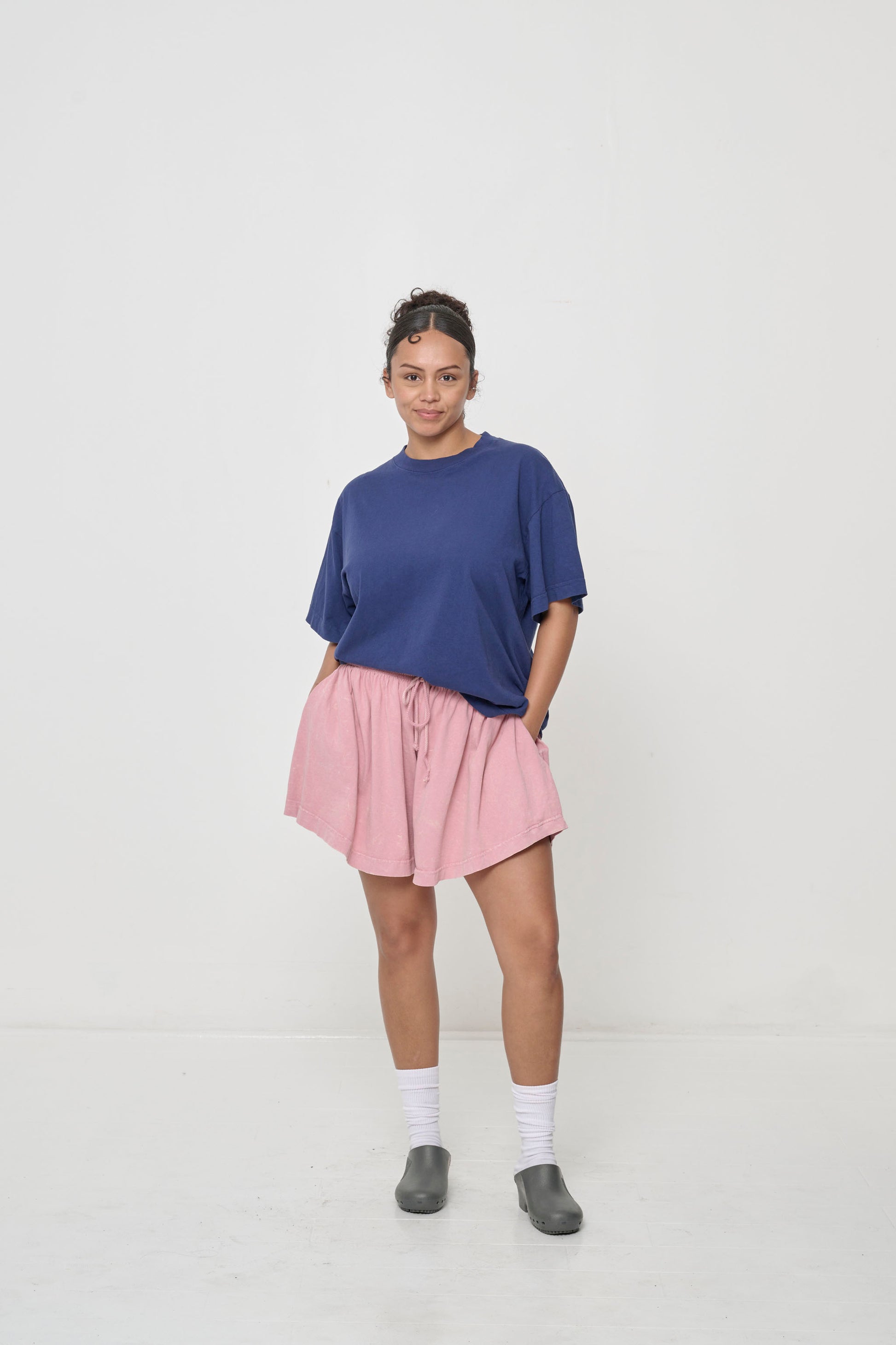 Styled with Wild Rose Tubular Shorts fora loose fitting look.