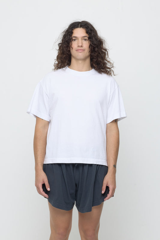 6' tall person wearing White Boxier Trash Tee in size M. Bottom hem at the lower middle hip.