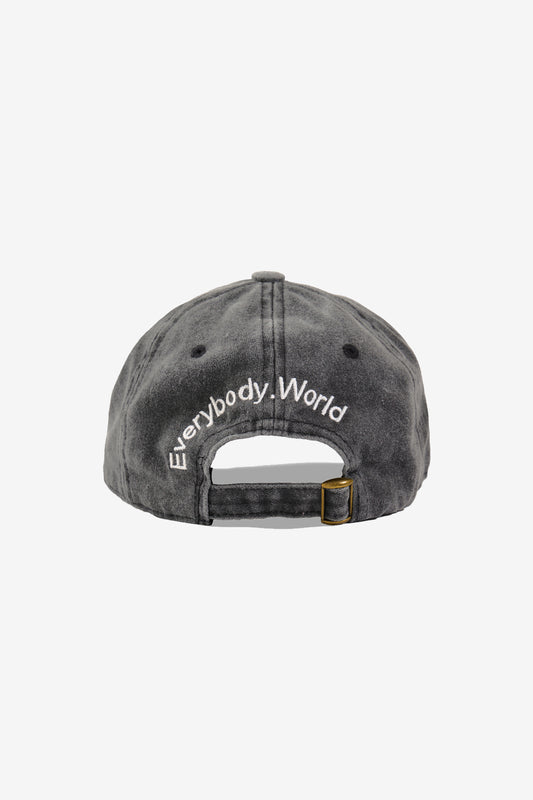 Back view showing "Everybody.World" embroidered over the adjustable opening.