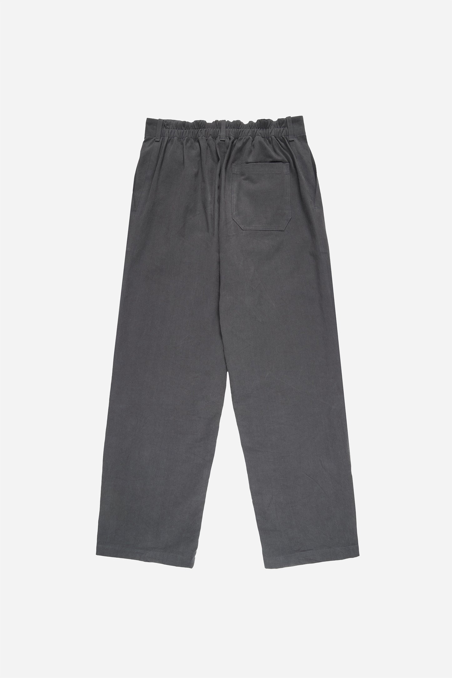 Flat lay back view shows gathering below elastic side of the waistband.