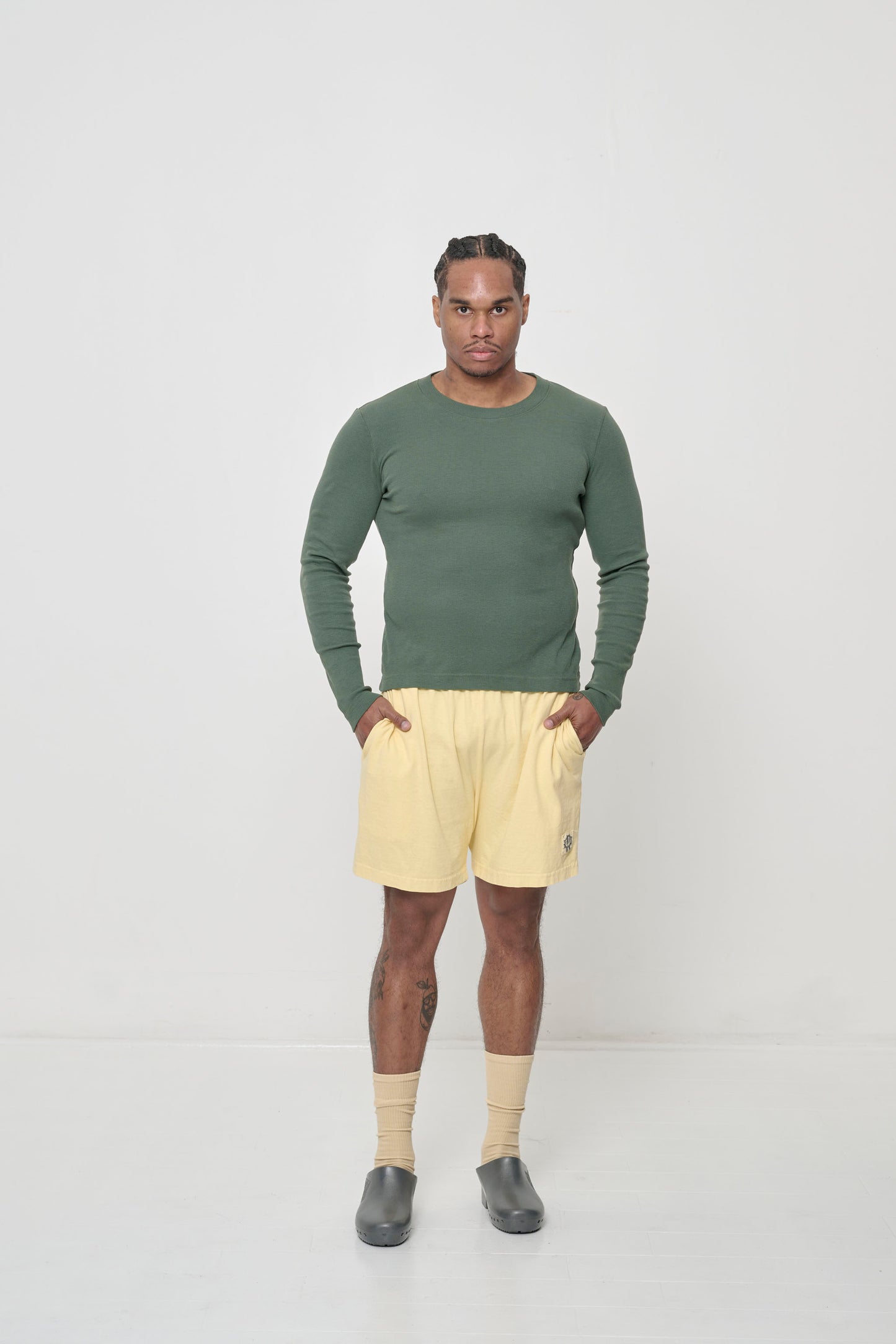 Styled with Pine Rib Long Sleeve pulled over waist of the shorts.