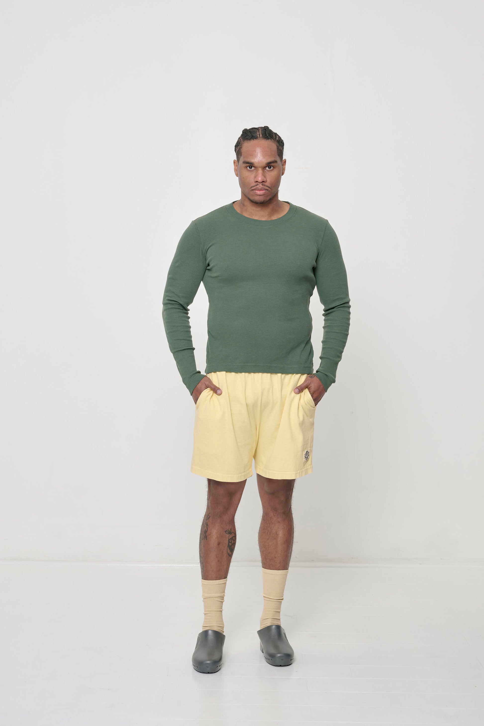 Styled with Pine Rib Long Sleeve pulled over waist of the shorts.
