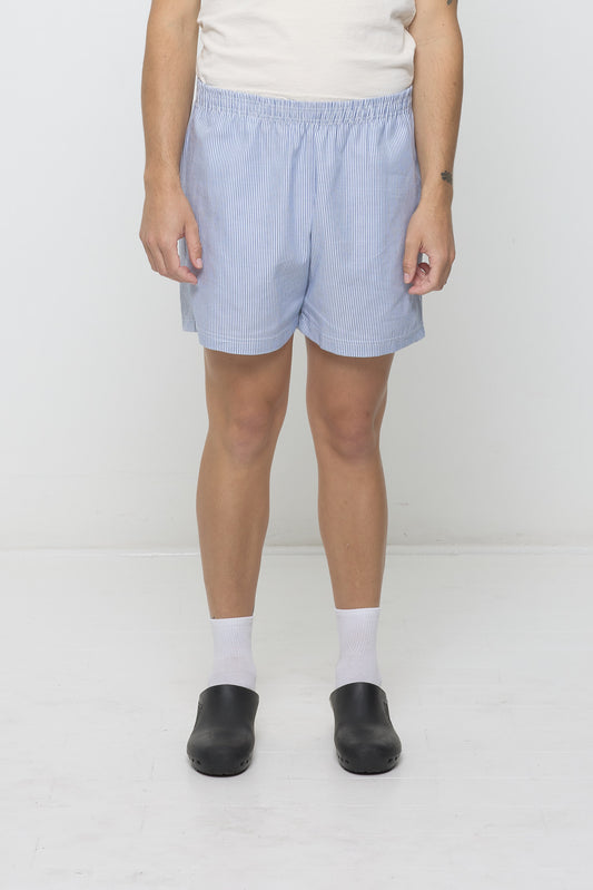 Stripe Poplin Everyday Shorts size M on a 6' model, front. Hem hits their mid thigh.