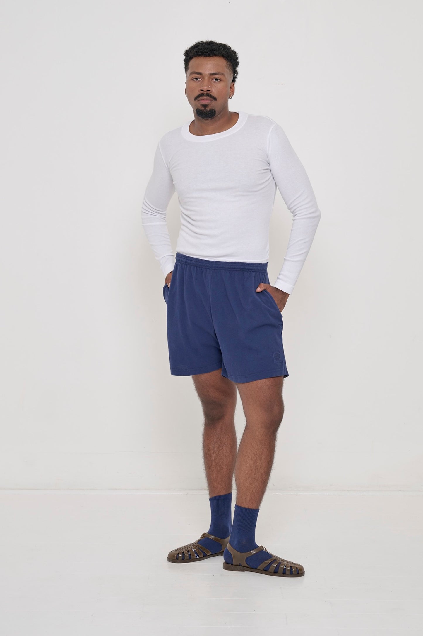 Washed Navy Everyday Shorts on model, paired with White Rib Long Sleeve tucked into waist of the shorts.