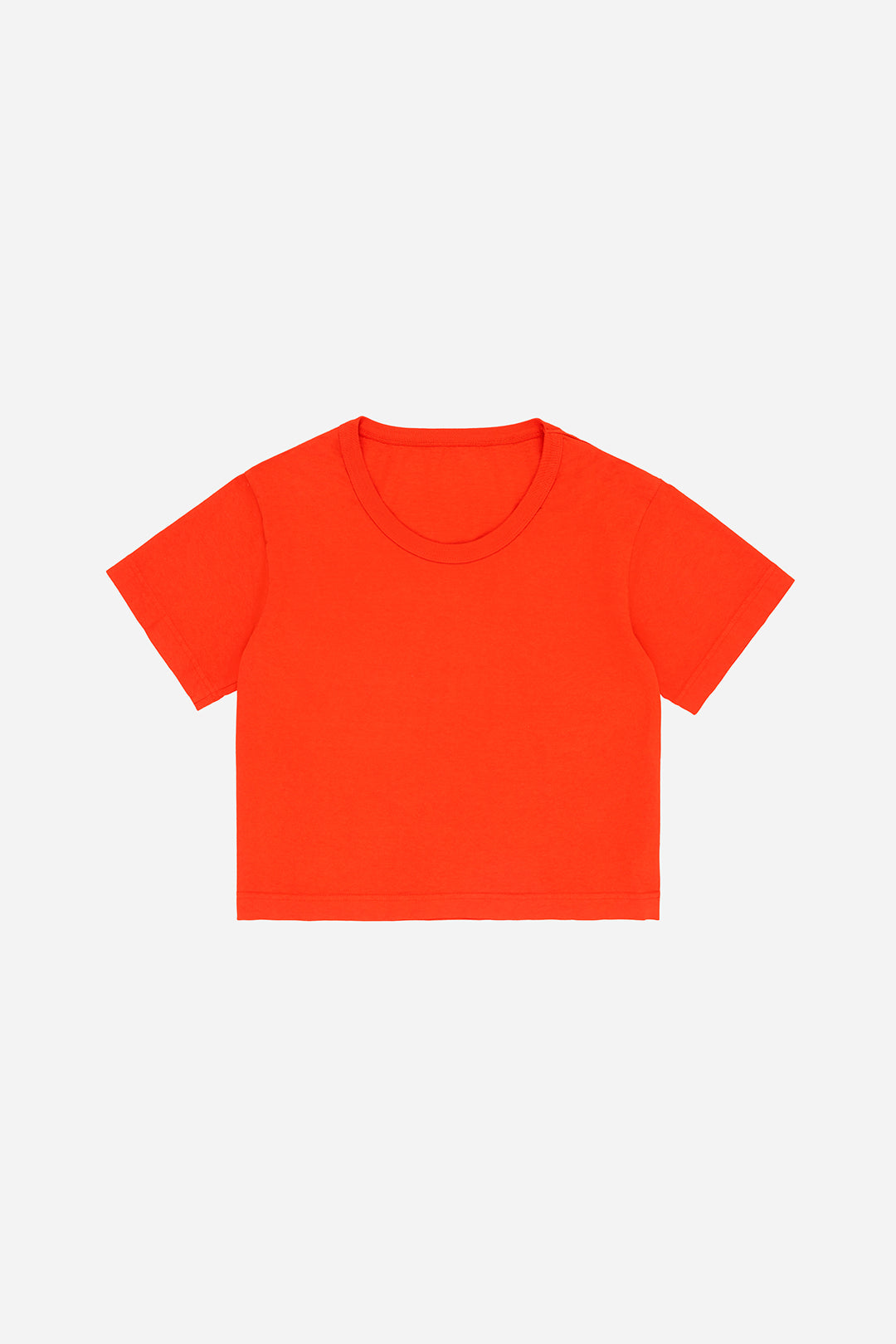 Flat lay of Hot Orange Good Weather Trash Tee showing cropped boxy shape.