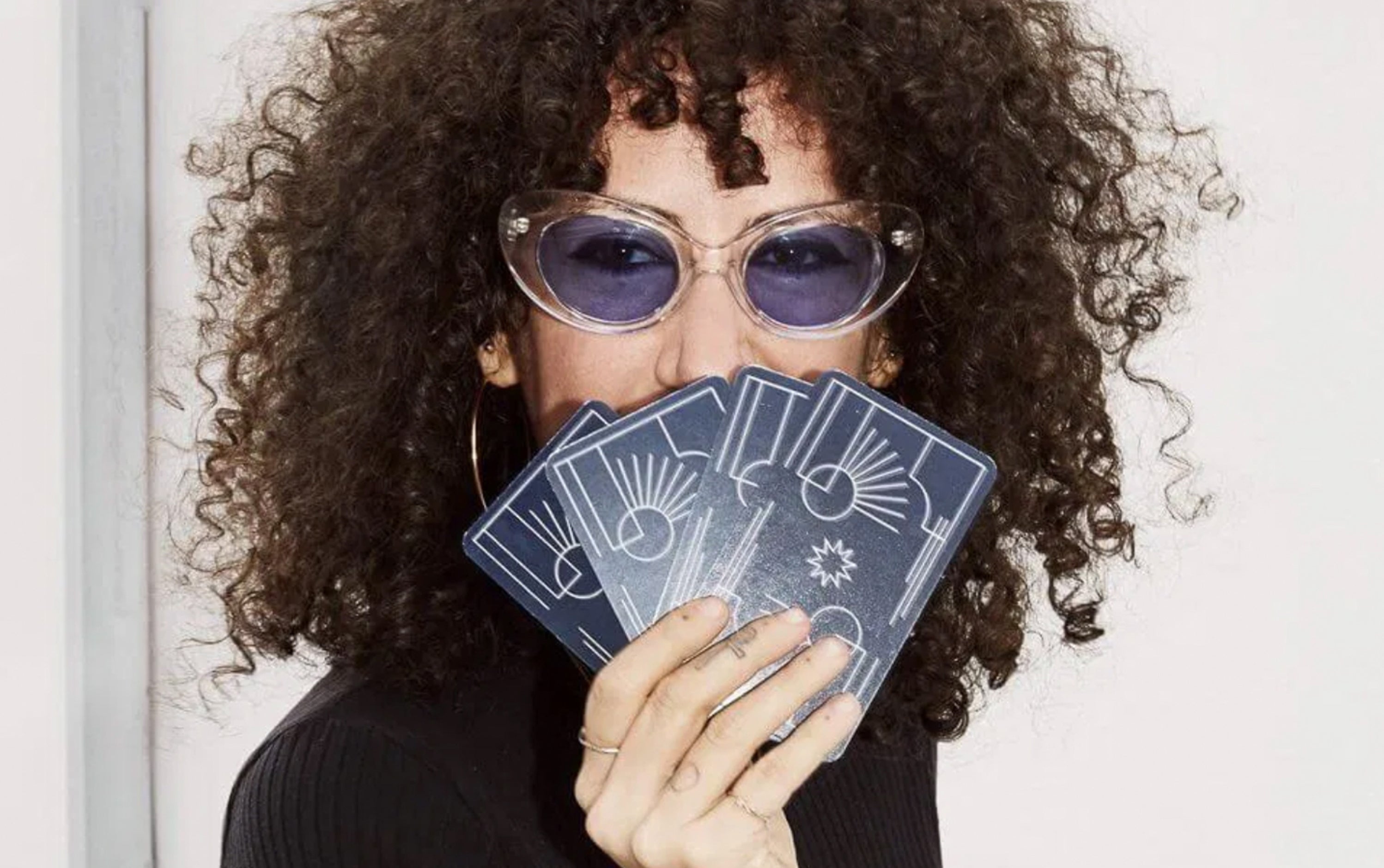 Jerico Mandybur holding tarot cards