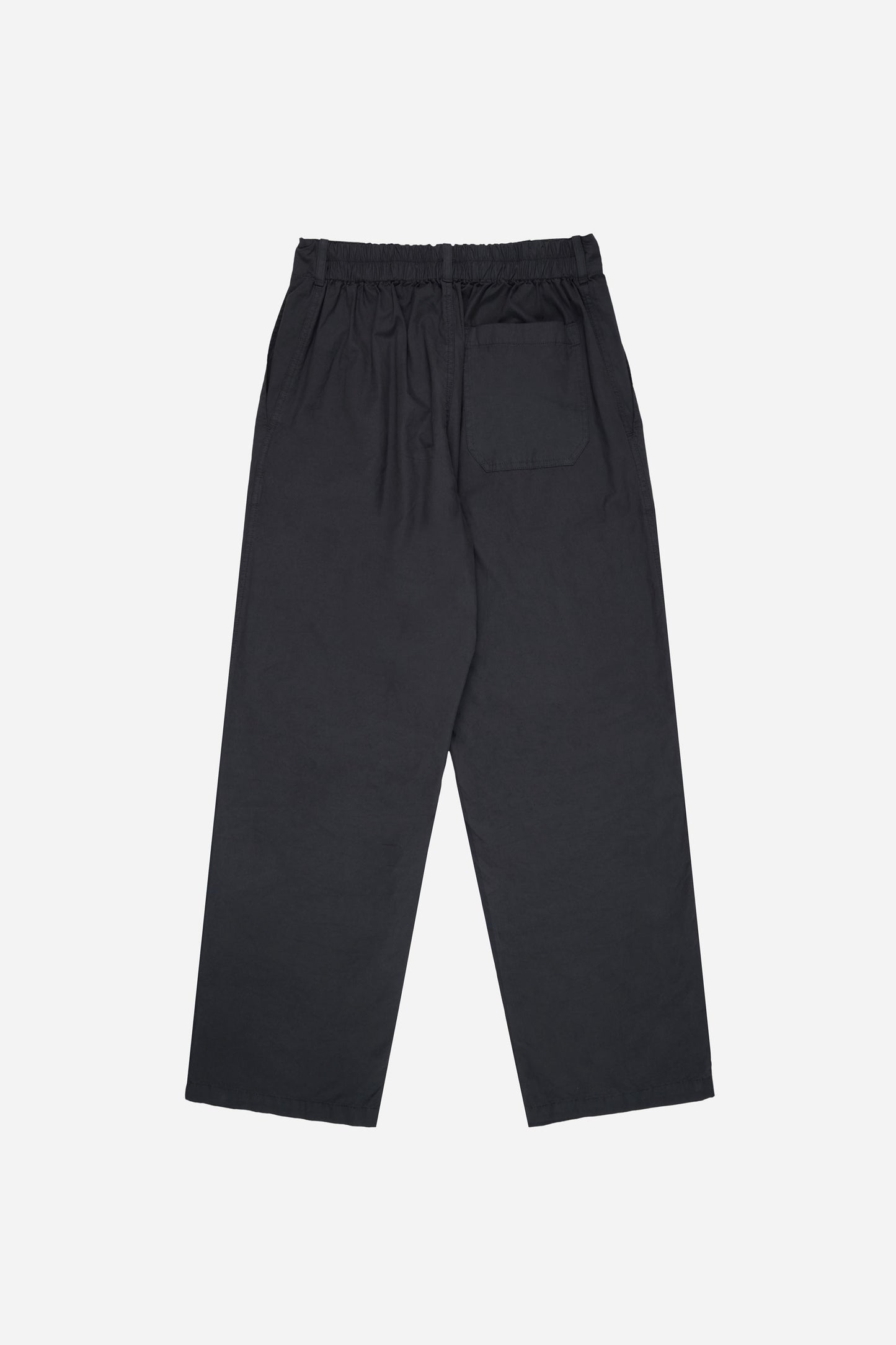 Flat lay back of Slate Life Uniform Pants: elastic waistband, fabric gathering below waistband, and right back pocket visible.
