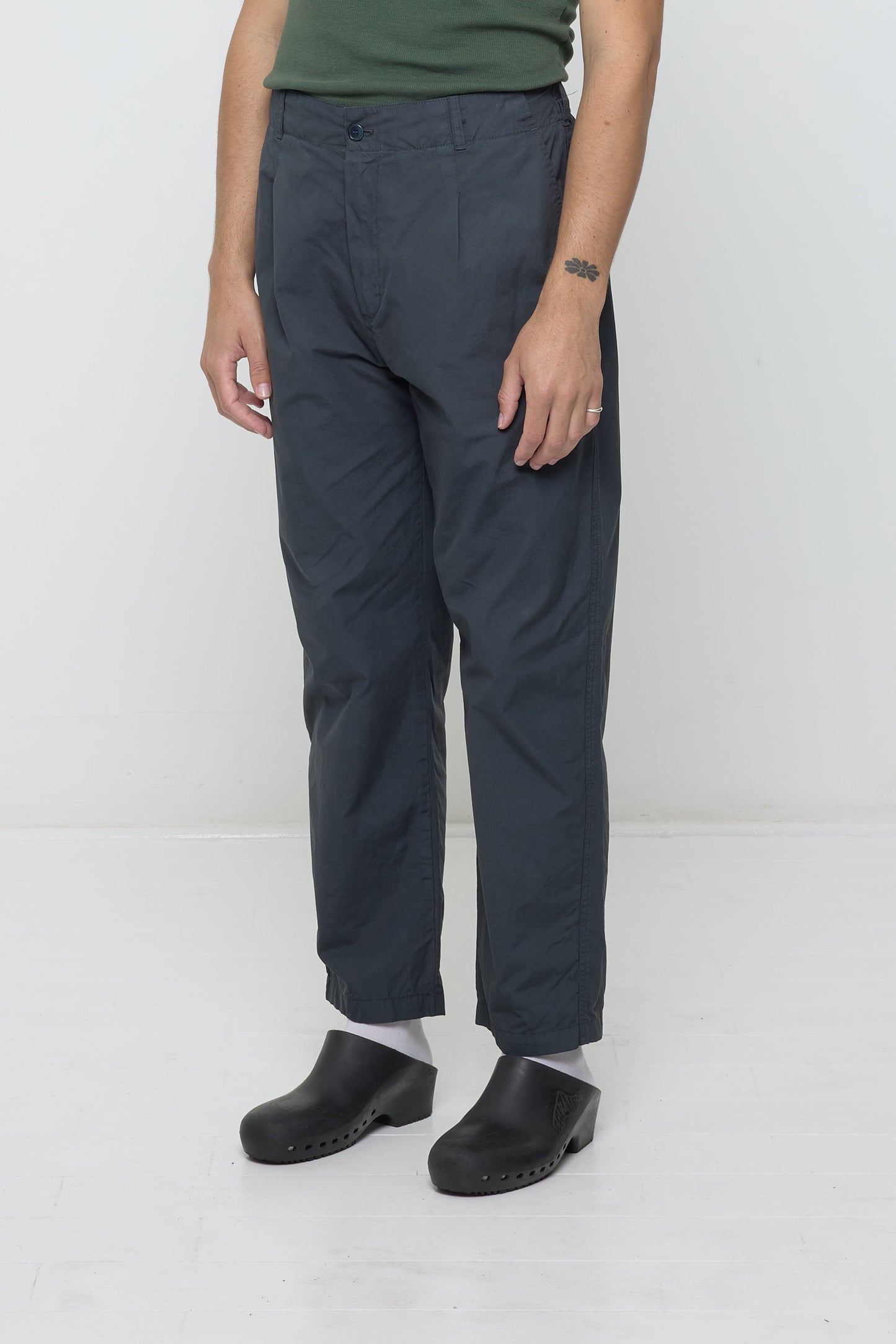 Bottom half of person turned at 3/4 angle wearing Life Uniform Pants in Slate showing the inseam and outseam.