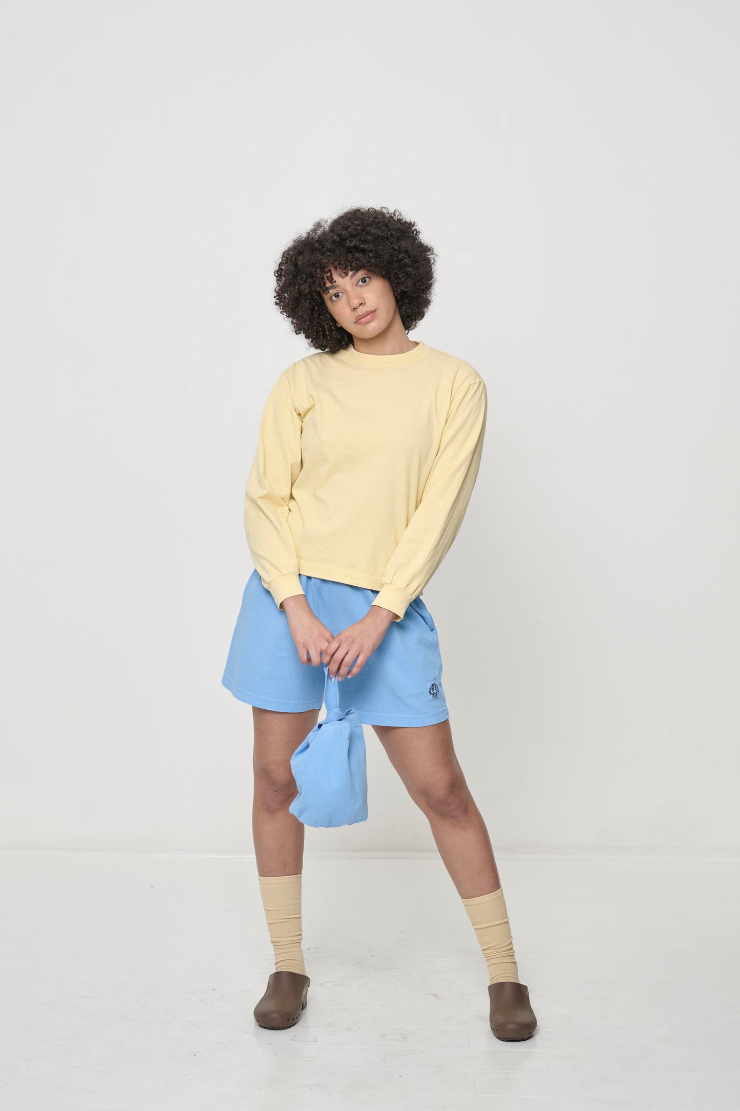 Styled with Everyday Shorts, Loop Tote, Squishy Socks, and Brown Calzuro Classic  Clogs.