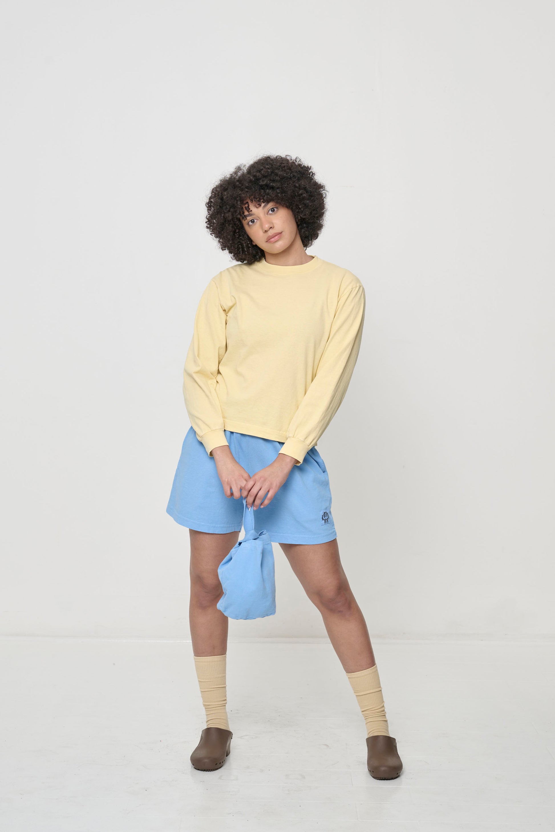 Styled with Everyday Shorts, Loop Tote, Squishy Socks, and Brown Calzuro Classic  Clogs.