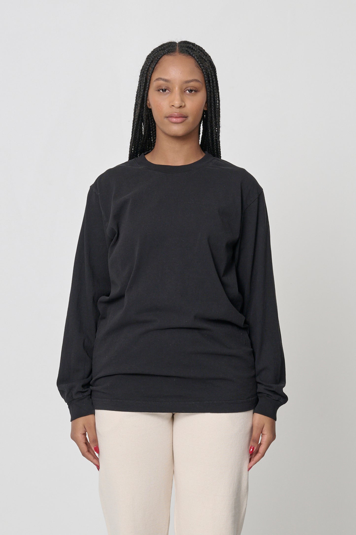 5'10" woman in size M Black Long Sleeve Trash Tee; shirt hem just below the hip, arms at her sides.