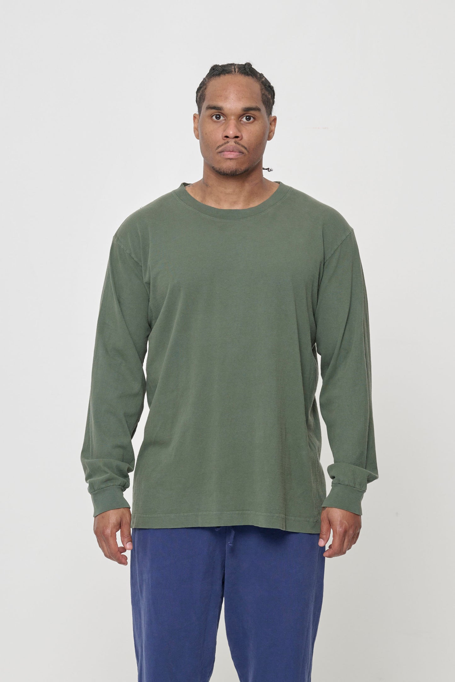A 6' man wearing Pine green Long Sleeve Trash Tee in size L. Shirt hem hits just below the hip.