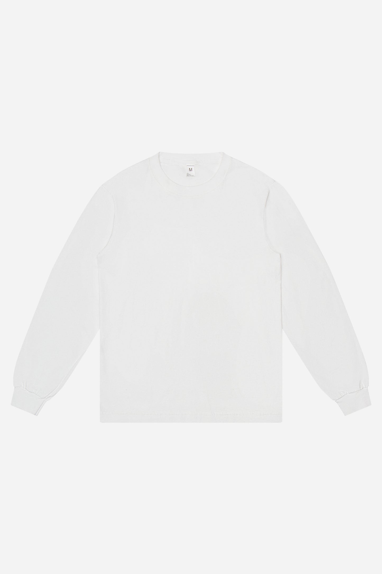 Flat lay of White Long Sleeve Trash Tee showing the classic long sleeve tee silhouette.