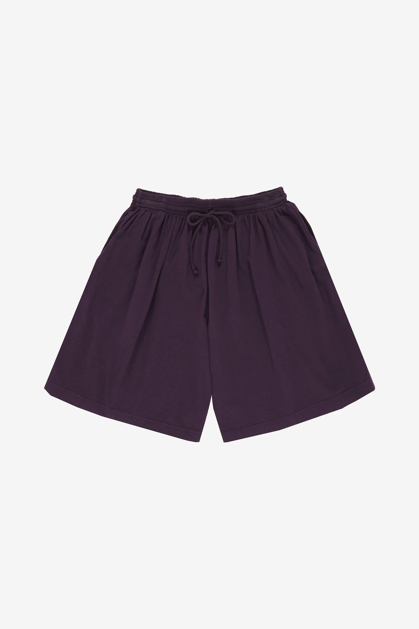 Flat lay: Front view shows waist gathers extending to wide legs. Drawcord ties are visible.