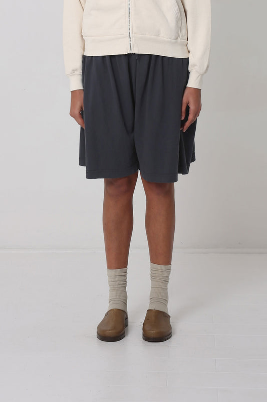 5'10" person in Slate Long Tubular Shorts. Hem ends mid-knee.