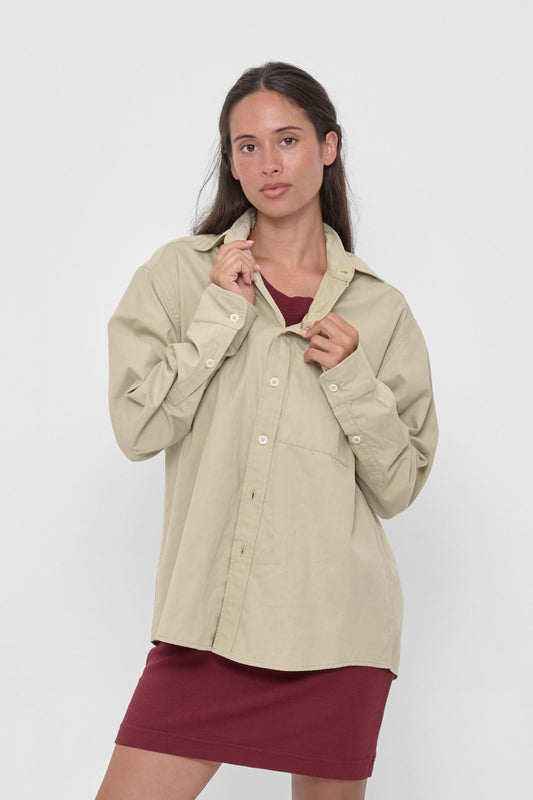 Peach Fuzz Button-Up Shirt in Oat – front view on model, worn over a Garnet Rib Dress