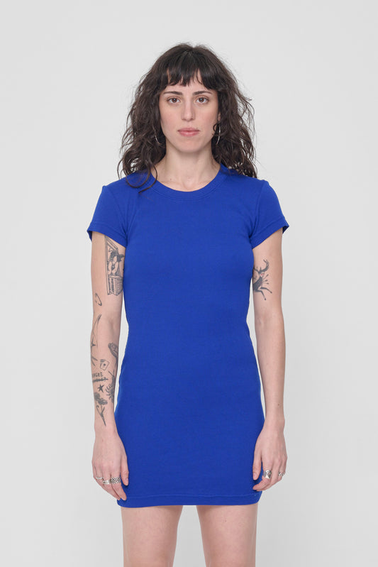 A 5'6" woman in a size S Lapis Rib Dress. Bottom hem ends upper mid-thigh.