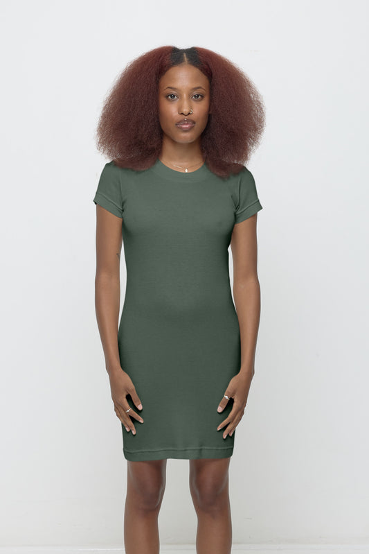 A 5'3" woman in an XS Pine green Rib Dress. Hem hits a few inches above her knee.