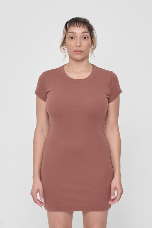 A 5'4" woman in a size M Potting Soil Rib Dress. Bottom hem ends mid-thigh.