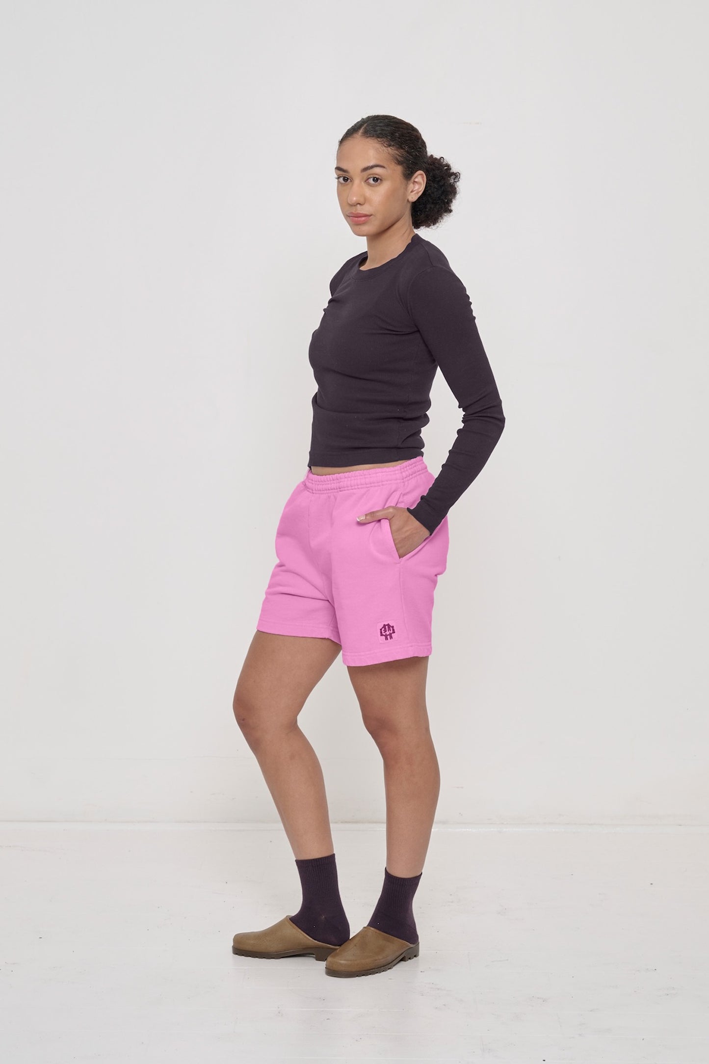 Styled with intentional bunching at the torso for the hem to hit just above the waistband.
