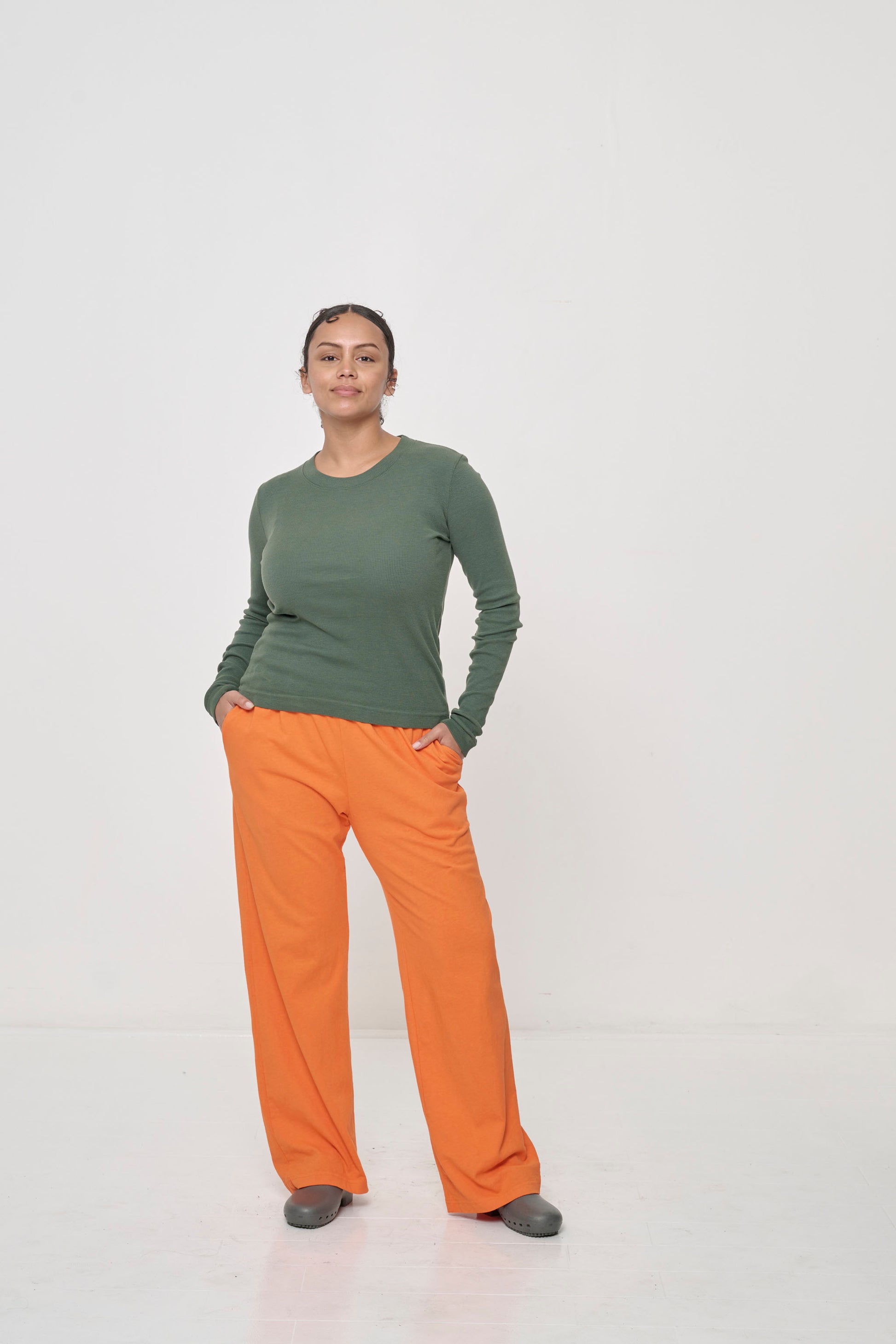 Styled with orange Apartment Pants.