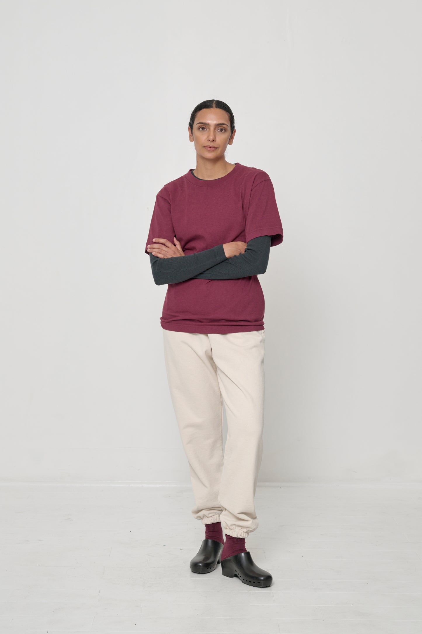 Rib Long Sleeve as a base layer: A woman in a Short Sleeve Trash Tee layered over a Rib Long Sleeve in Slate.