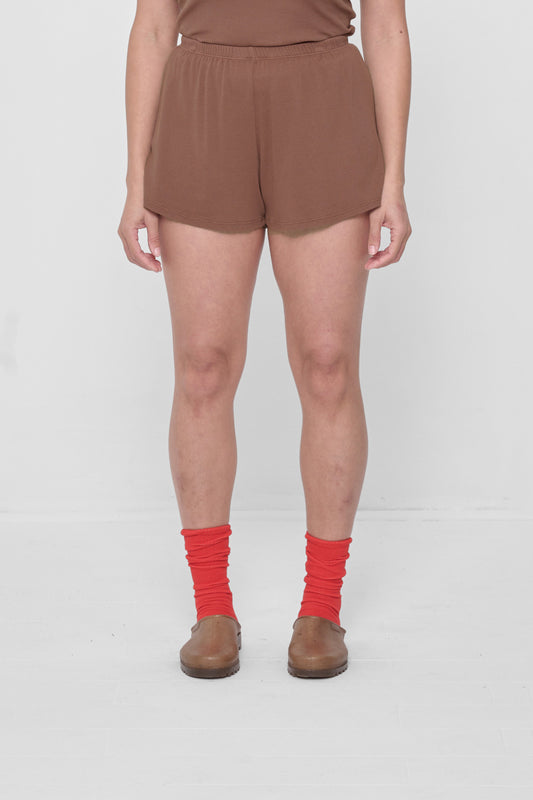 Size M Potting Soil Rib Shorts on 5'4" model. Relaxed fit, upper-thigh length.