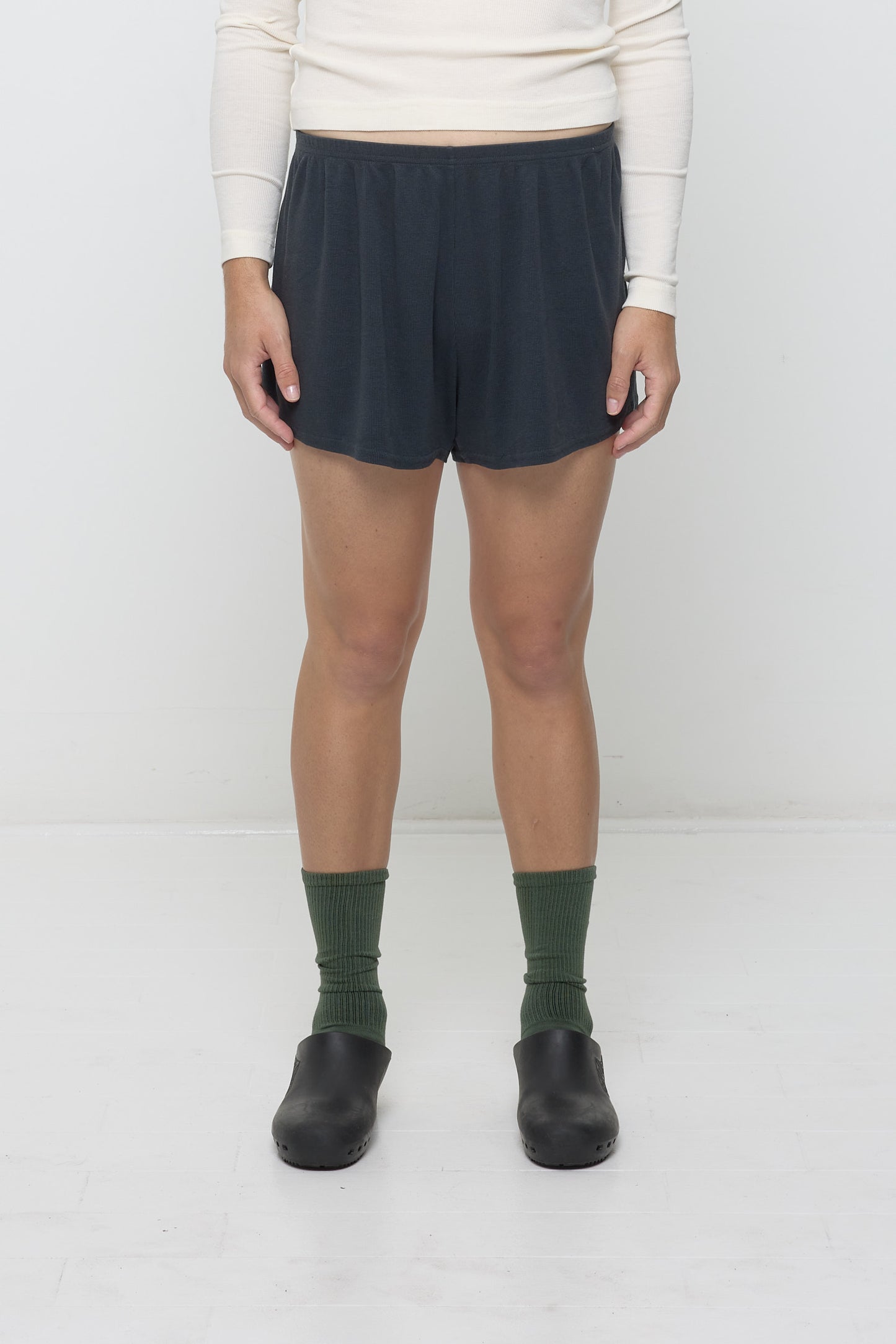 Slate Rib Shorts on model, front. Relaxed fit, upper-thigh length and elastic waist.