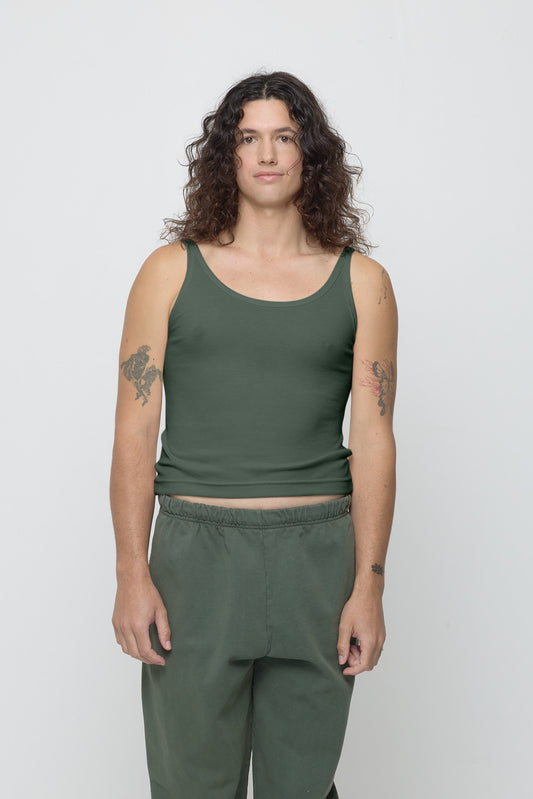 A 6' person wearing a size S Rib Tank in Pine. Hem rests on their upper hips.